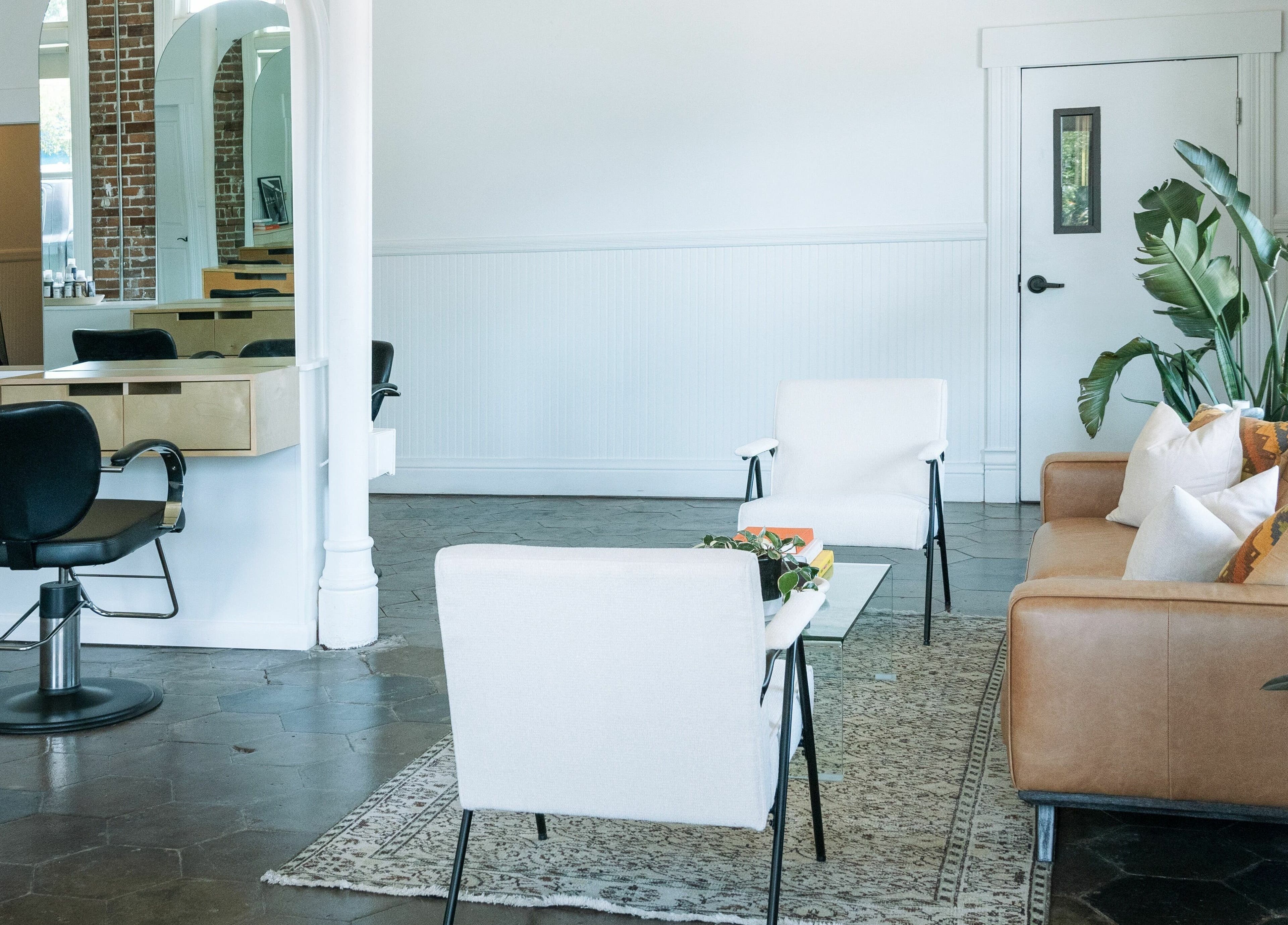Elegant salon interior at MATERIAL - Tampa in Tampa, Florida, US featuring chic seating and modern decor.