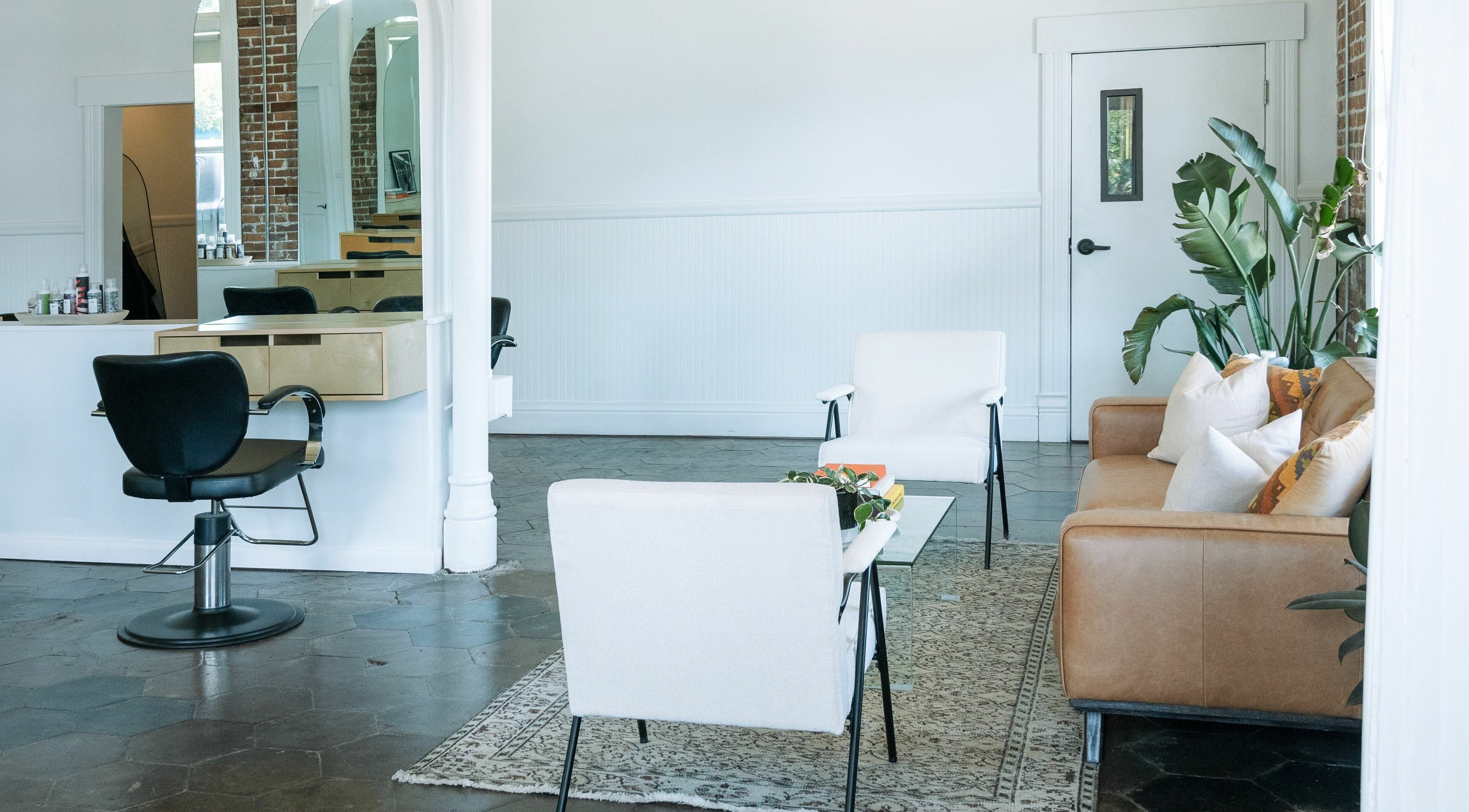 Elegant salon interior at MATERIAL - Tampa in Tampa, Florida, US featuring chic seating and modern decor.