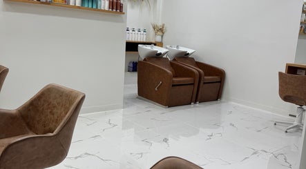 Modern wash stations and chairs at Melt Salon Collective in Nelson Bay, New South Wales, AU.