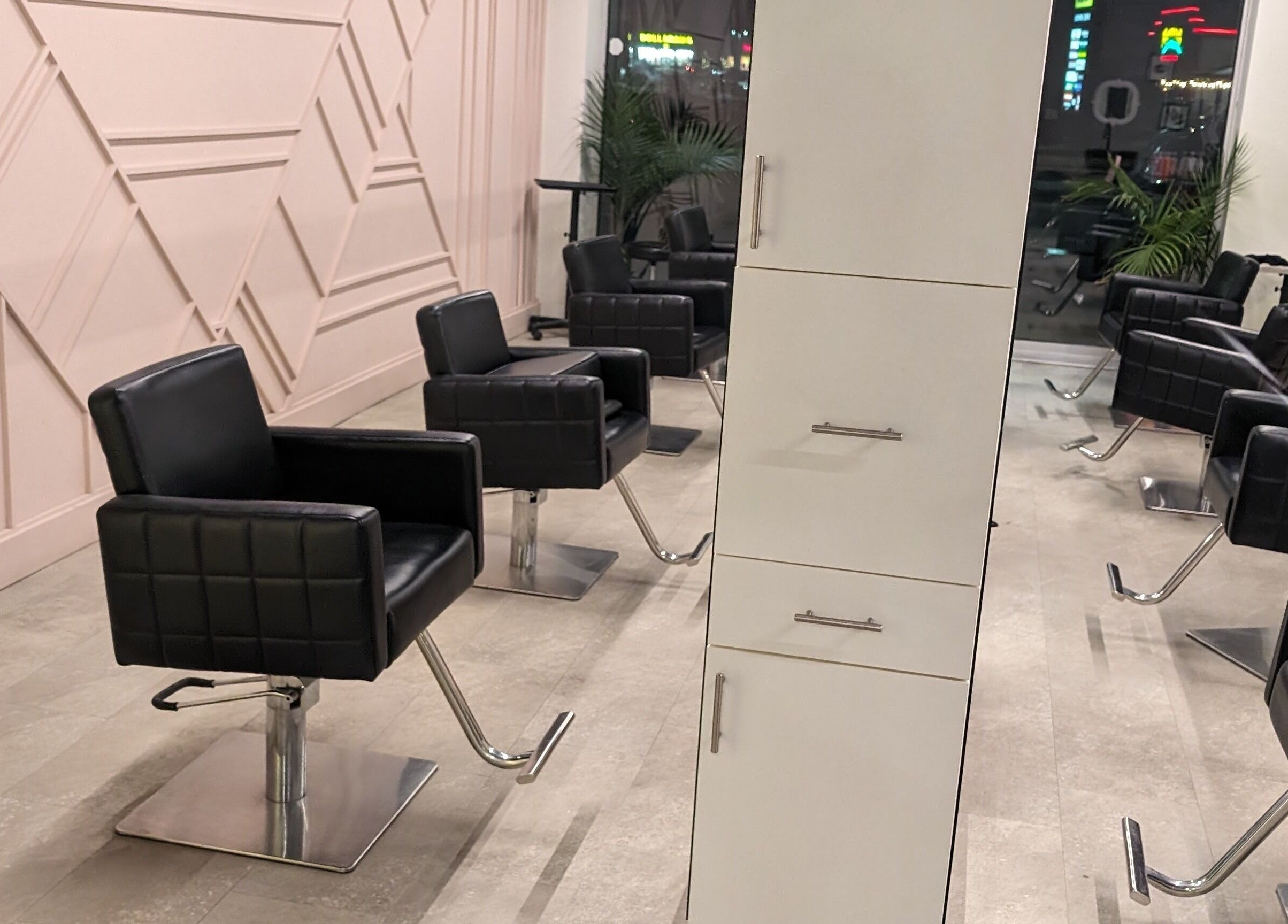 Modern styling chairs at Shear Amazement and Luminous Spa Inc. in Kitchener, Ontario, CA, ready for clients.