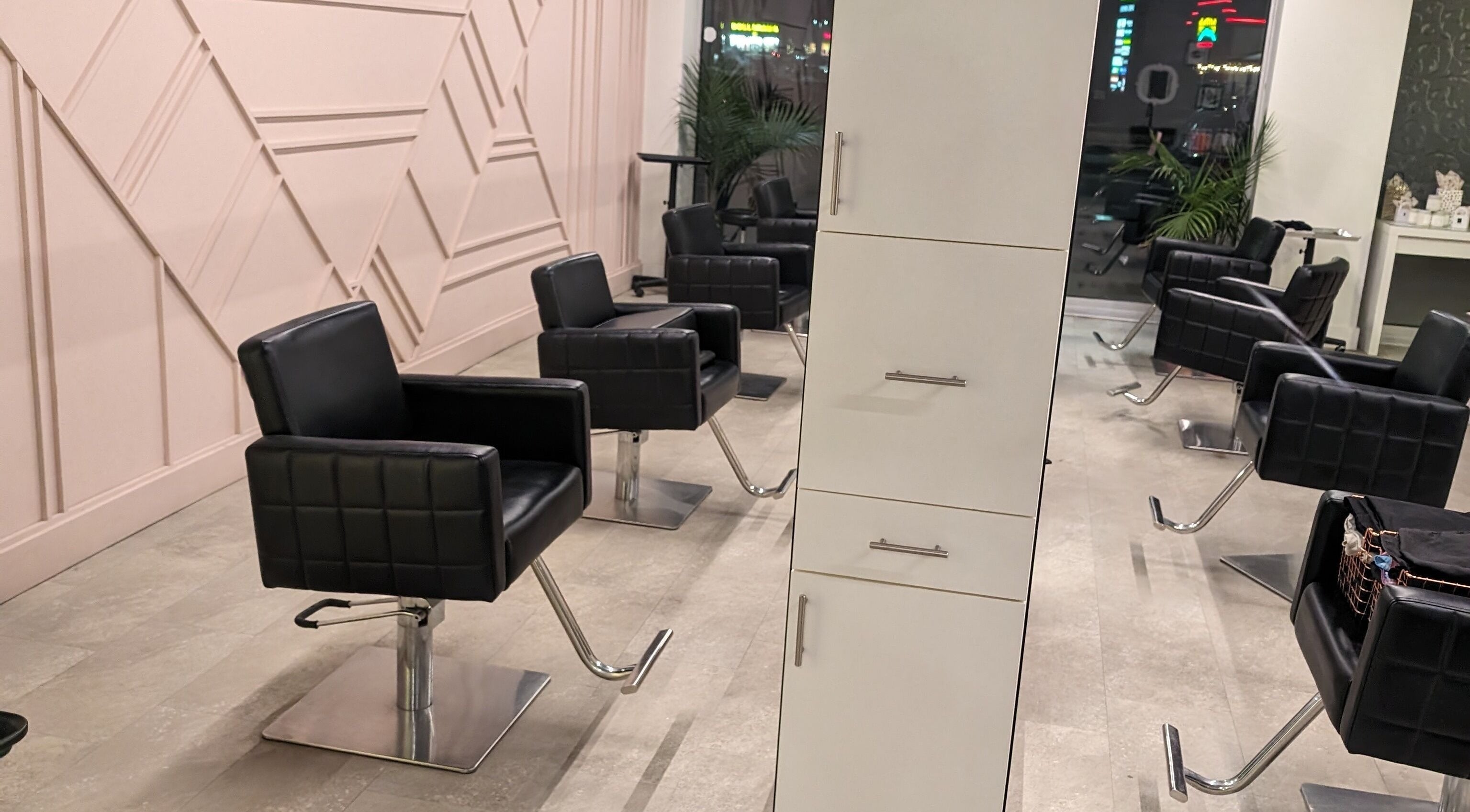 Modern styling chairs at Shear Amazement and Luminous Spa Inc. in Kitchener, Ontario, CA, ready for clients.