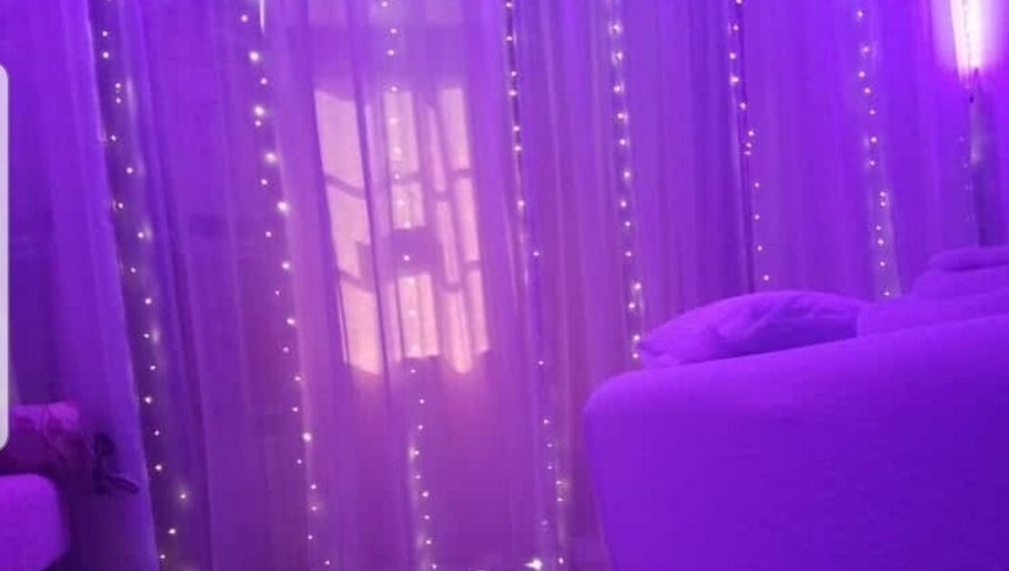 Serene purple-lit massage room at Misfit Massage Services, San Fernando, San Fernando City Corporation, TT.