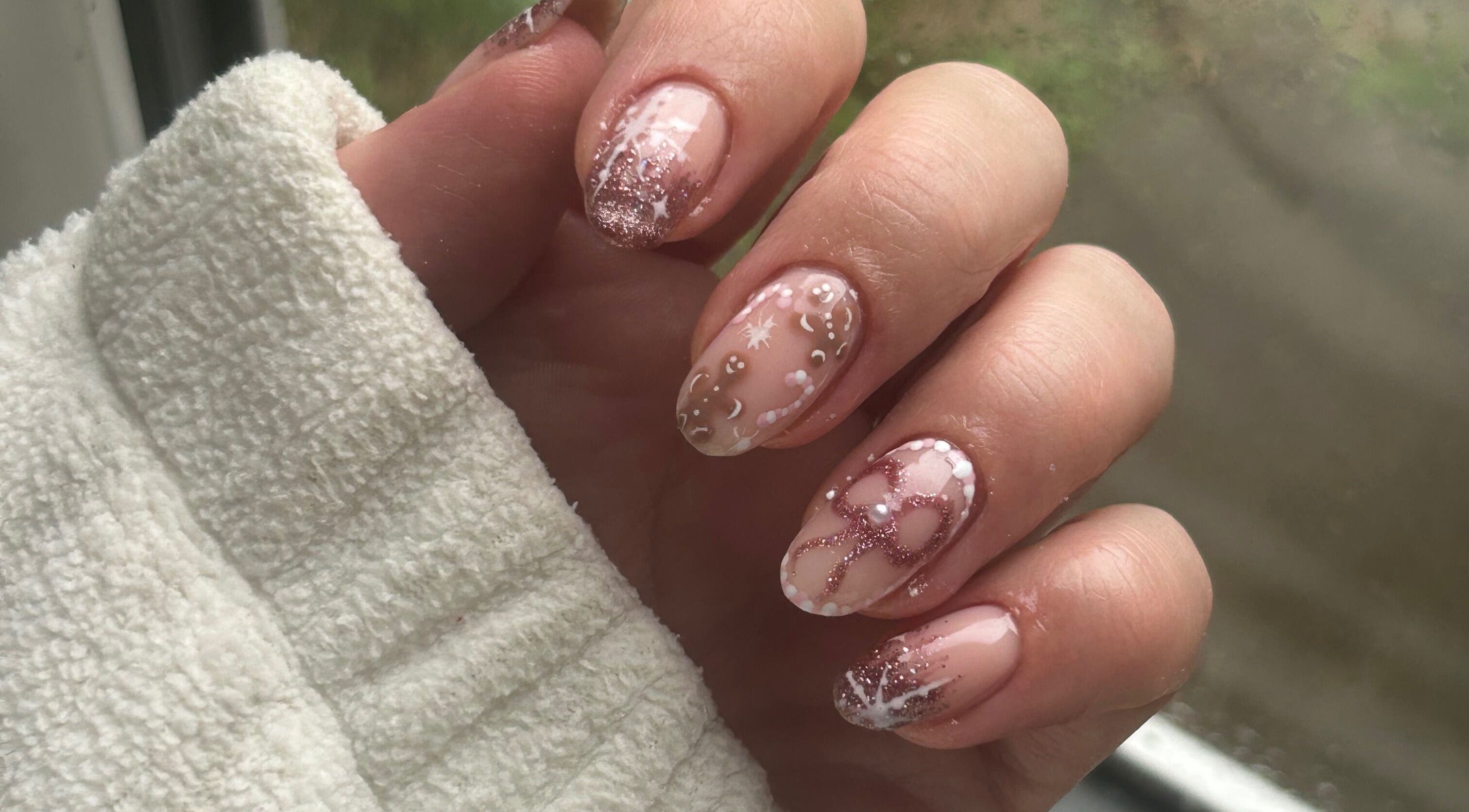 Intricate nail art with glitter and designs at Evie P Nails, Shifnal, England, GB.