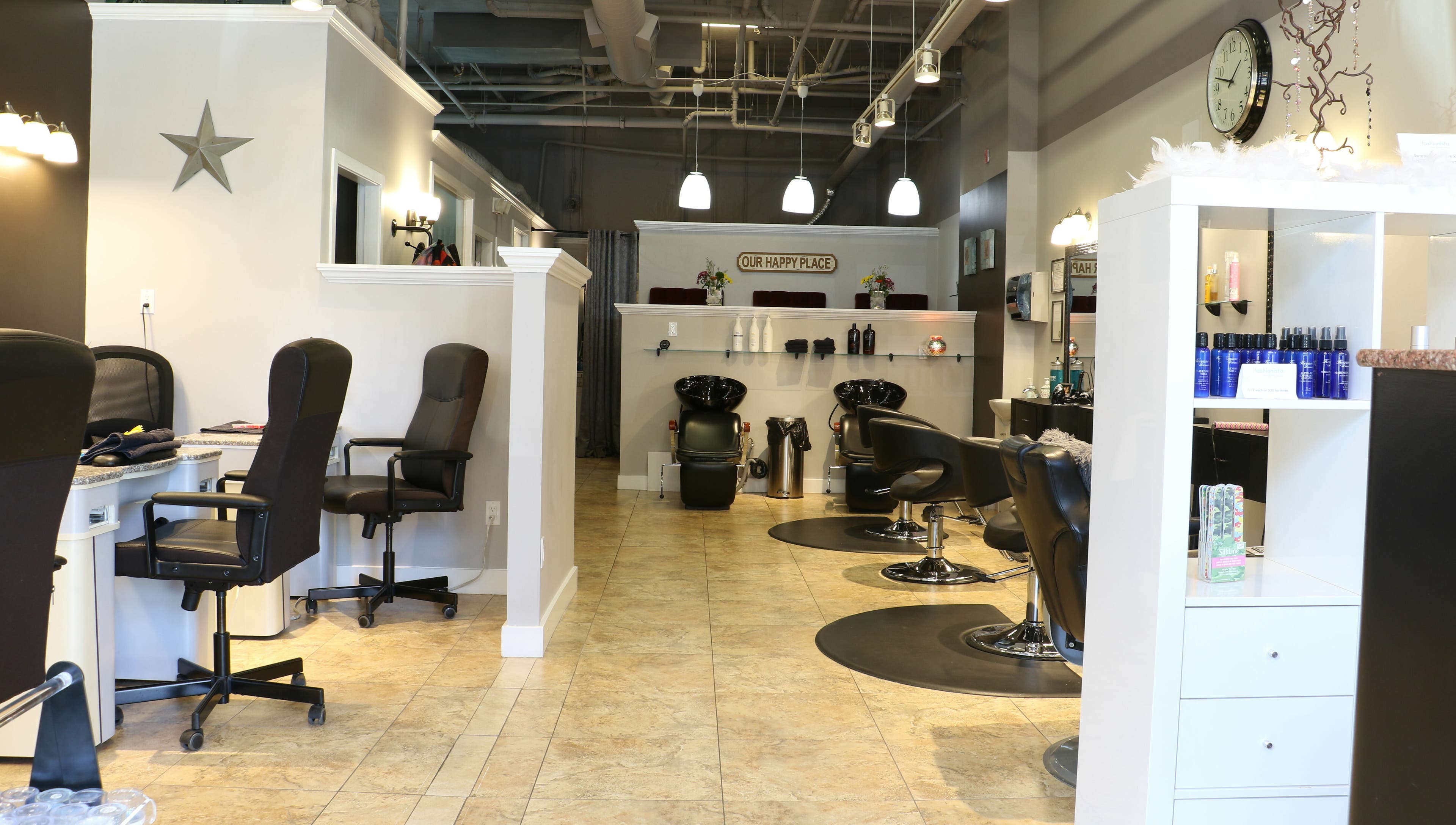 Interior of Boulevard Salon and Esthetics in Surrey, British Columbia, CA showcasing stylish workstations.