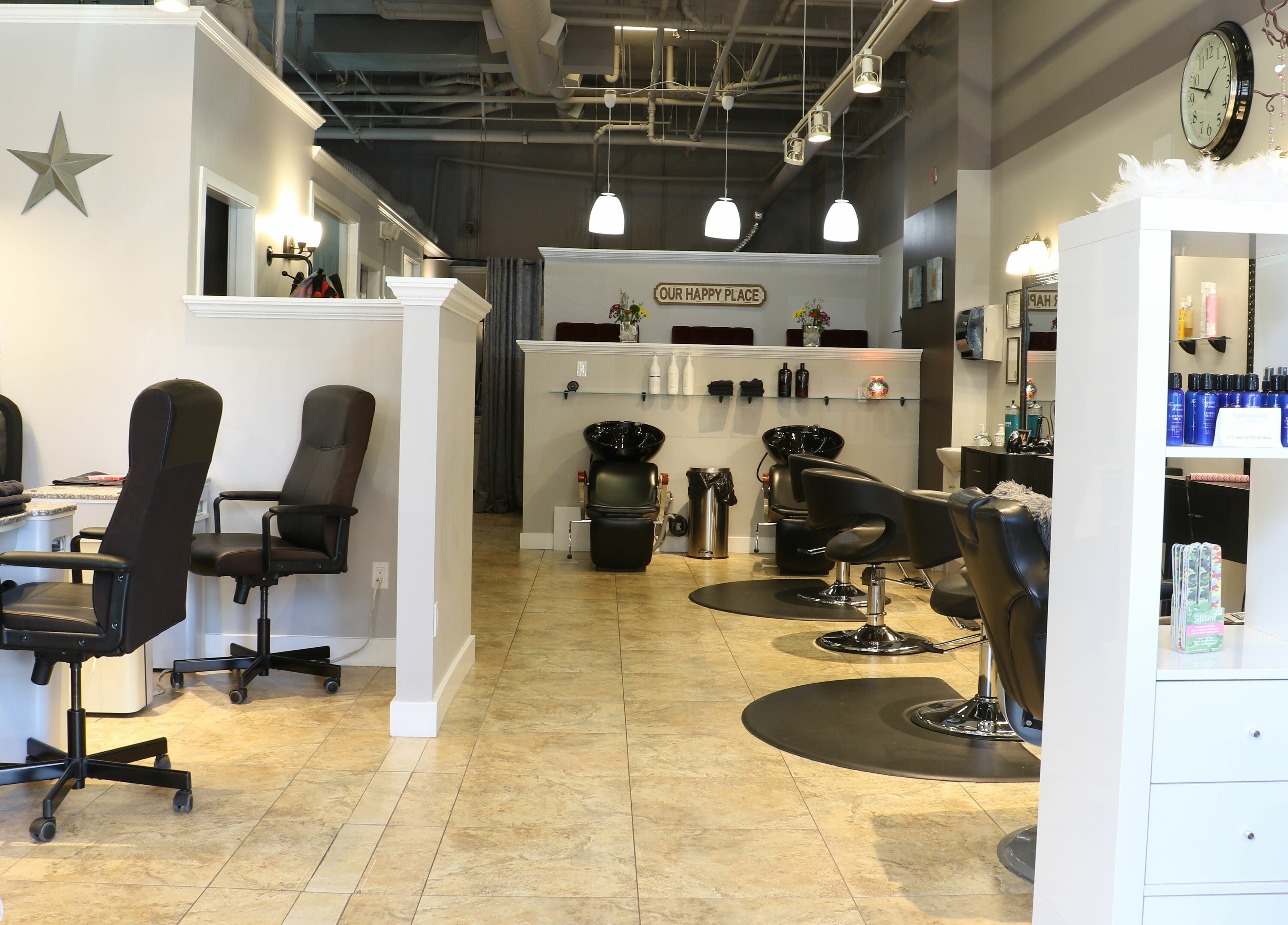 Interior of Boulevard Salon and Esthetics in Surrey, British Columbia, CA showcasing stylish workstations.