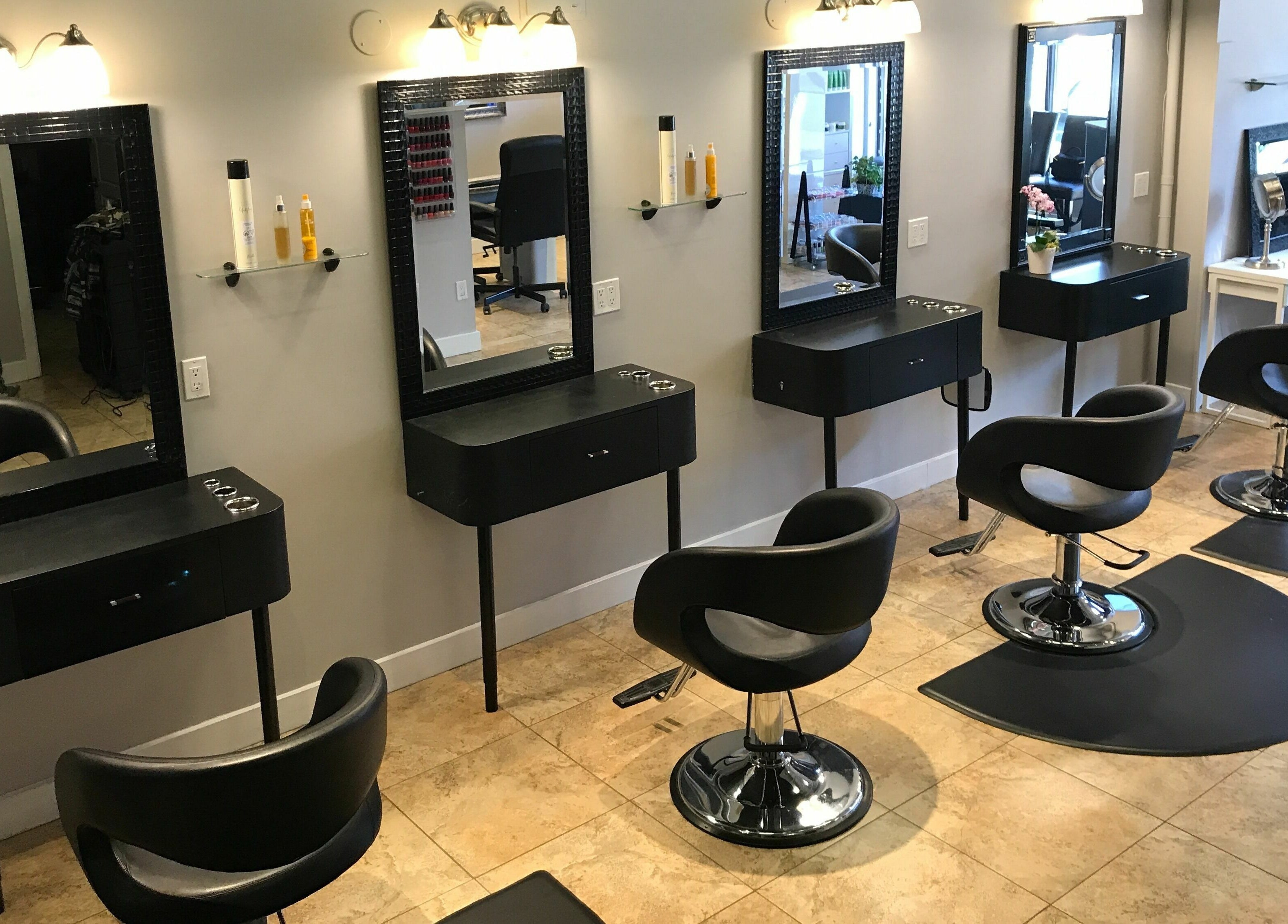 Interior of Boulevard Salon and Esthetics, Surrey, British Columbia, CA, featuring sleek styling stations.