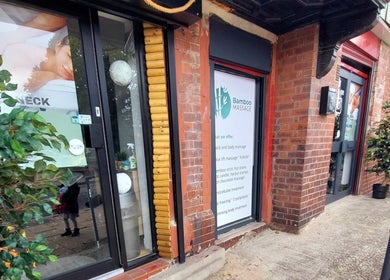 Front entrance of Massage Therapy at Bamboo Massage, South Elmsall, England, GB with greenery and signage.