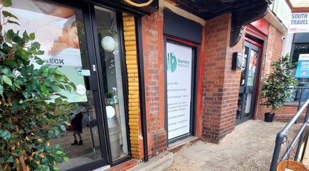 Front entrance of Massage Therapy at Bamboo Massage, South Elmsall, England, GB with greenery and signage.