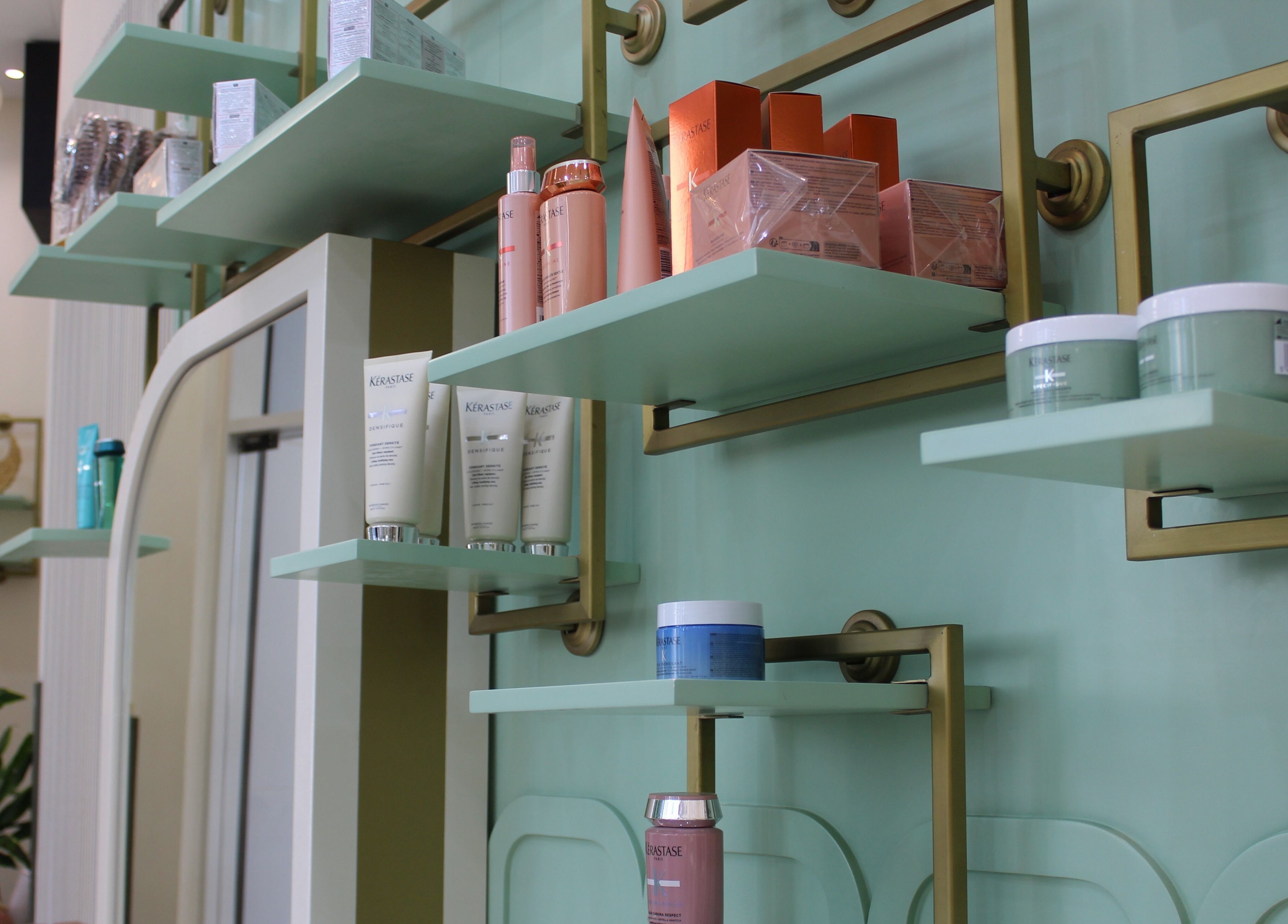 Elegantly designed product shelves at Blond Me Salon, Dubai, AE, showcasing premium beauty products.
