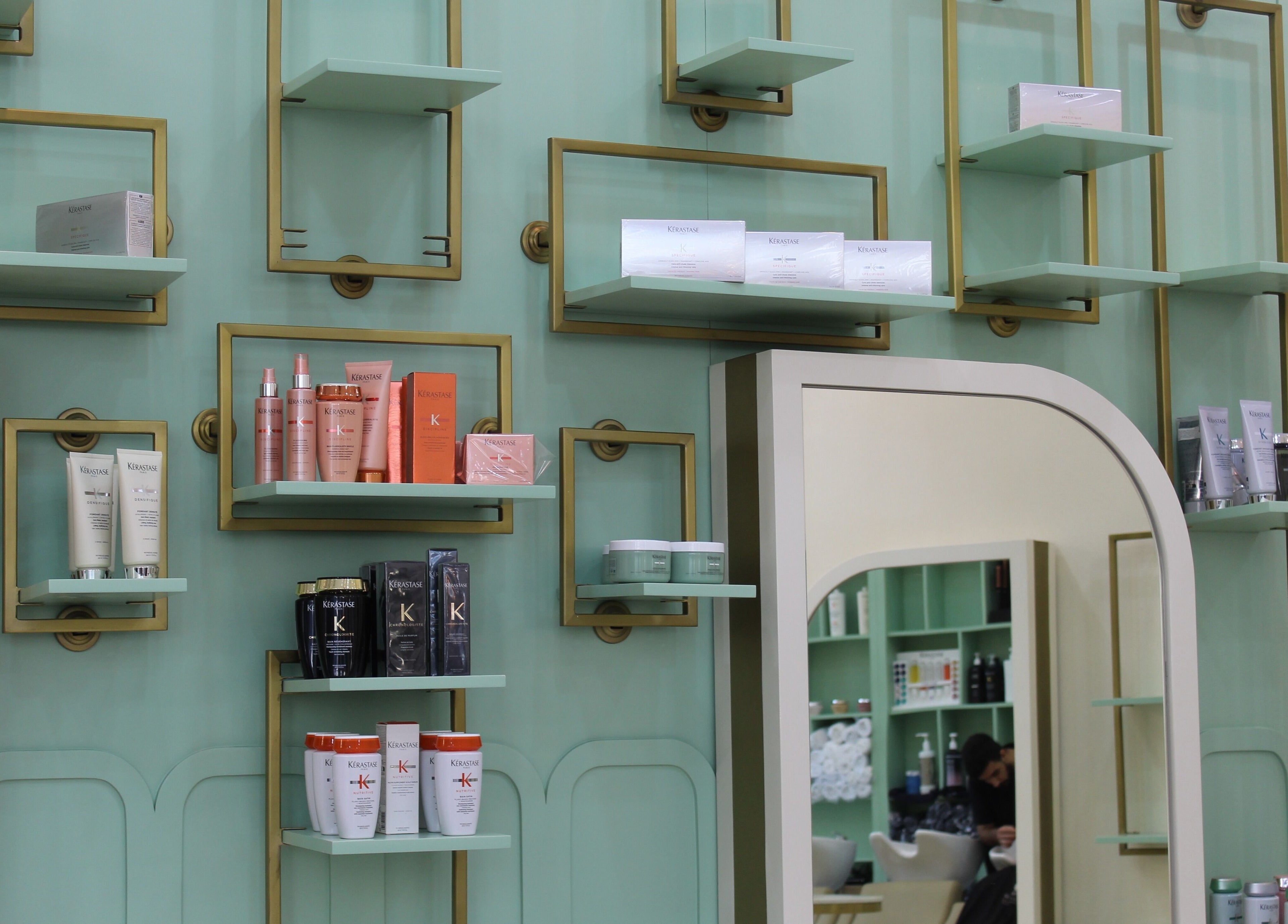 Stylish product shelves at Blond Me Salon, Dubai, AE showcasing premium haircare.