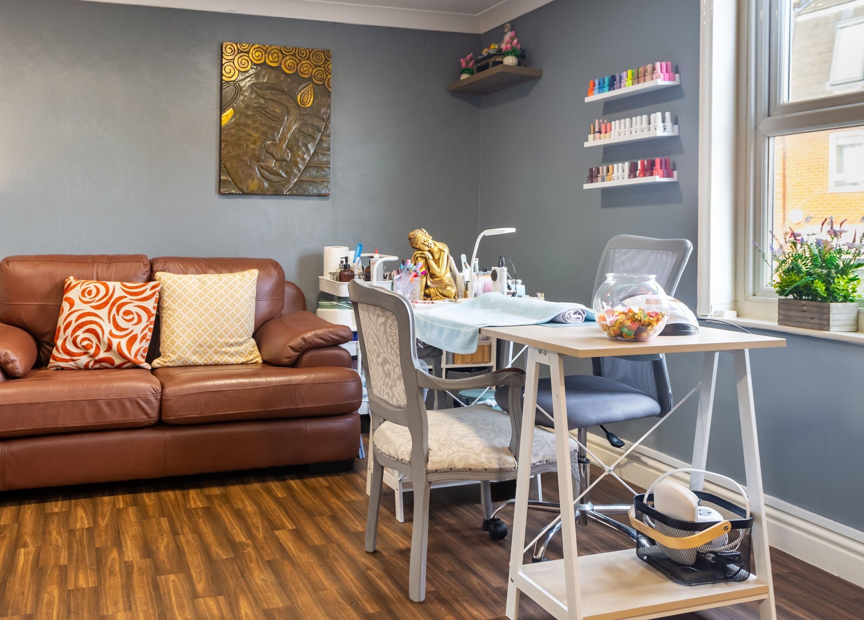 Cozy interior of Thai Spa & Clinic in March, England, GB with seating and spa equipment in a calm setting.