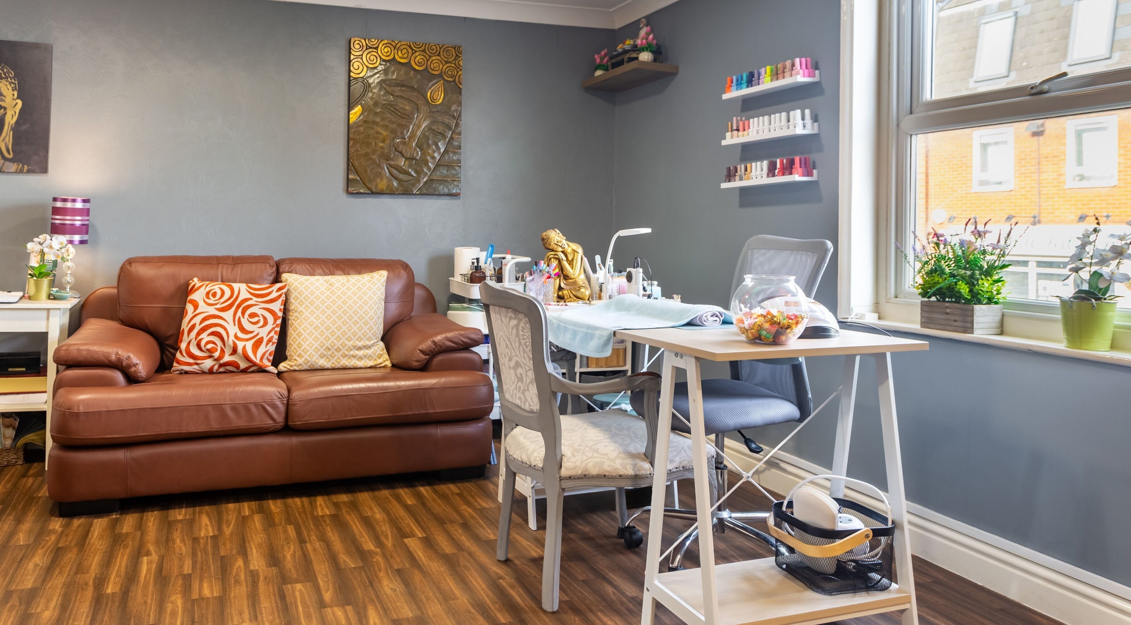 Cozy interior of Thai Spa & Clinic in March, England, GB with seating and spa equipment in a calm setting.