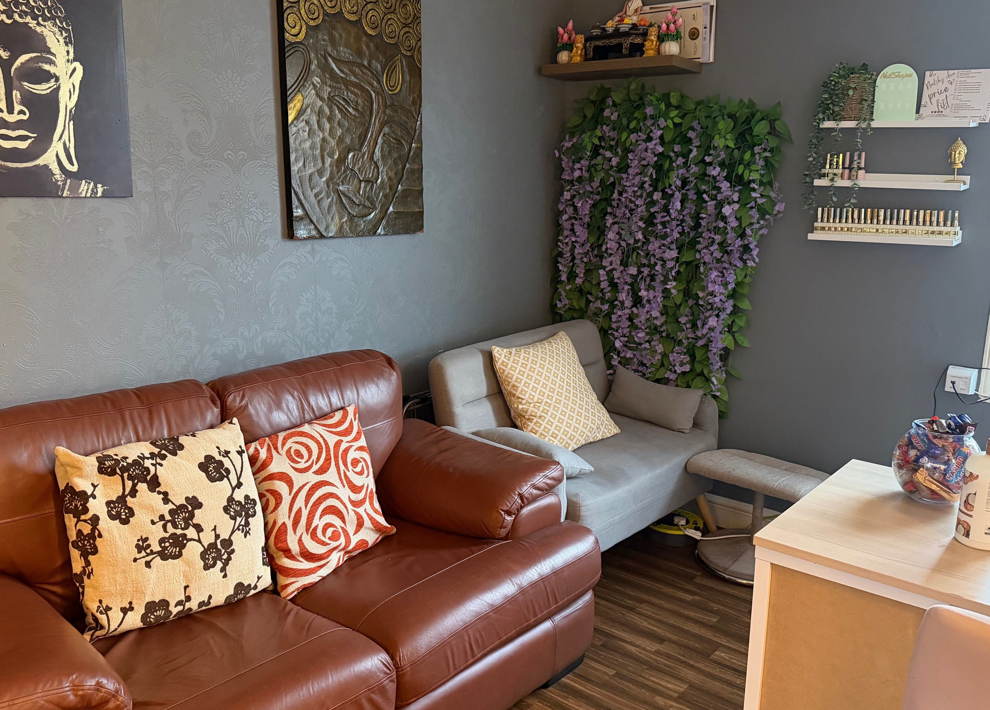 Cozy seating and Thai decor at Thai Spa & Clinic, March, England, GB for a relaxing experience.