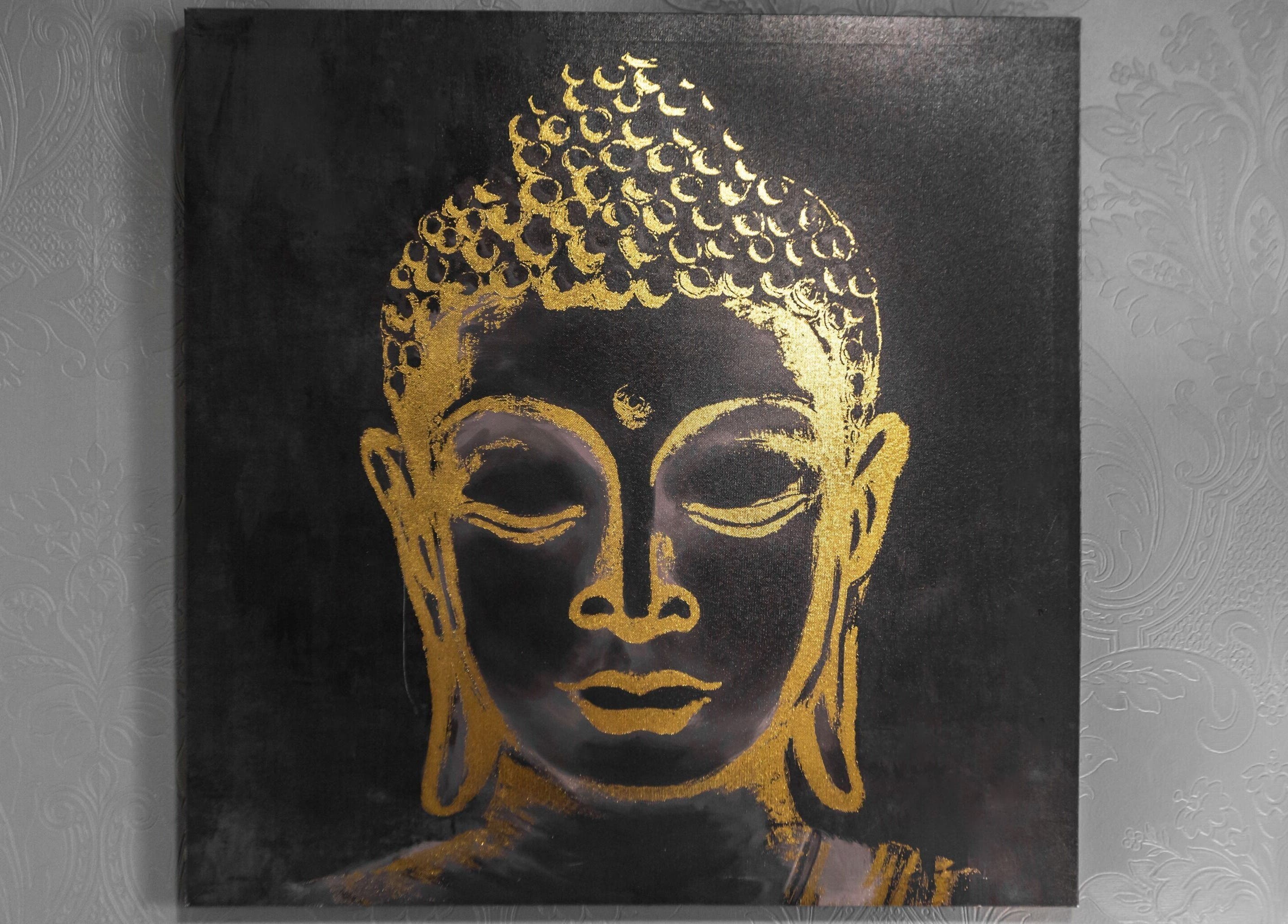 Serene Buddha art in gold at Thai Spa & Clinic, March, England, GB, enhances the tranquil ambiance.