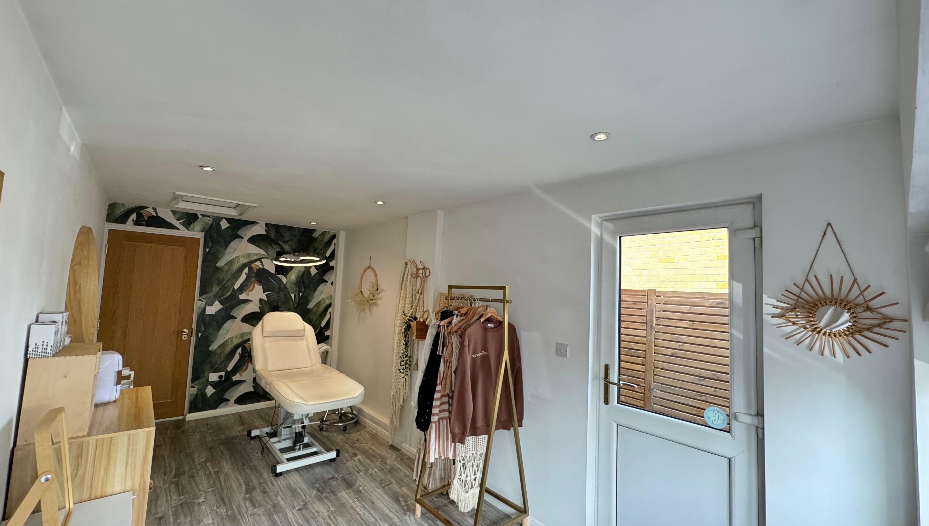 Stylish interior of SoVanilla Styling at Old Farm Park, England, GB. Features modern decor and treatment chair.