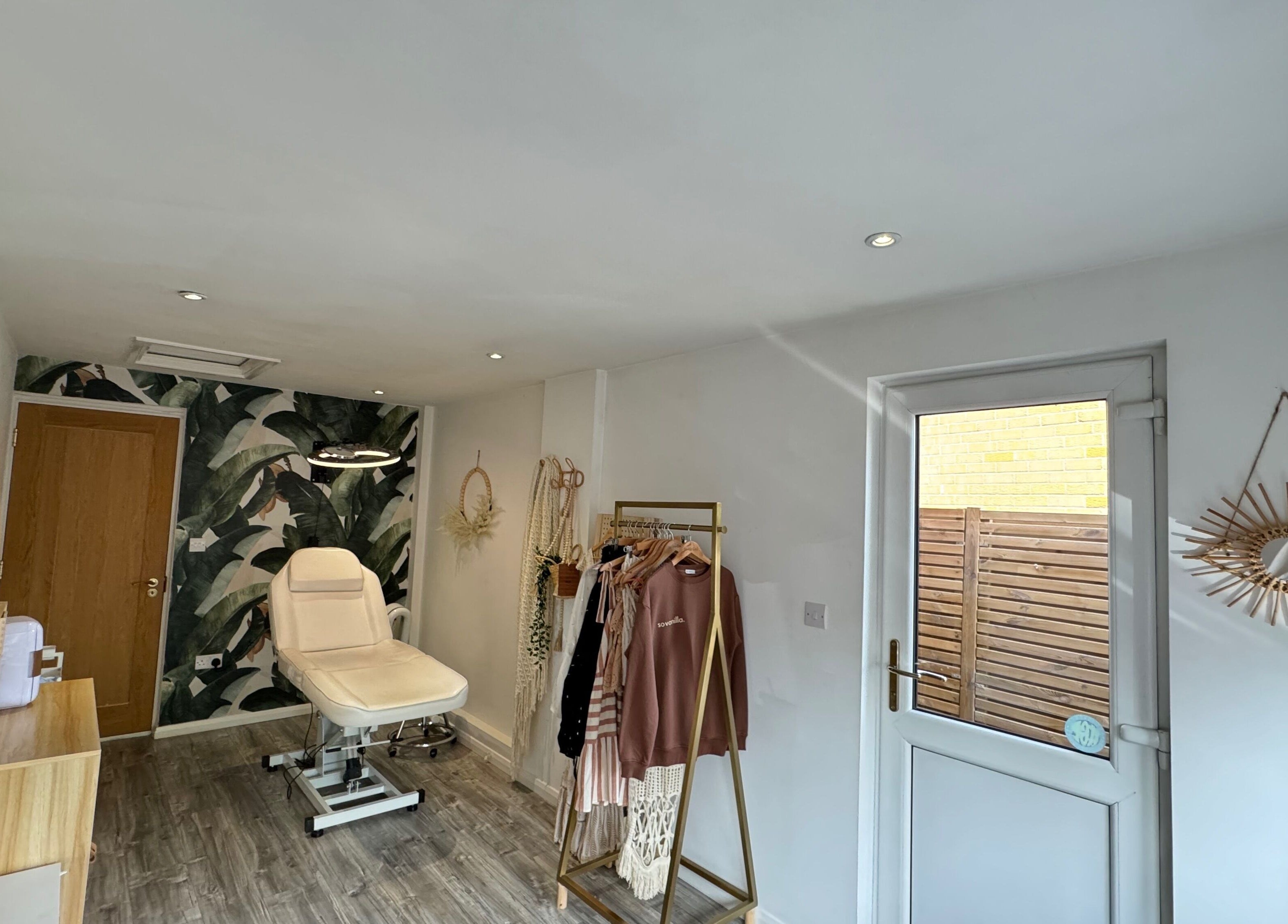 Stylish interior of SoVanilla Styling at Old Farm Park, England, GB. Features modern decor and treatment chair.