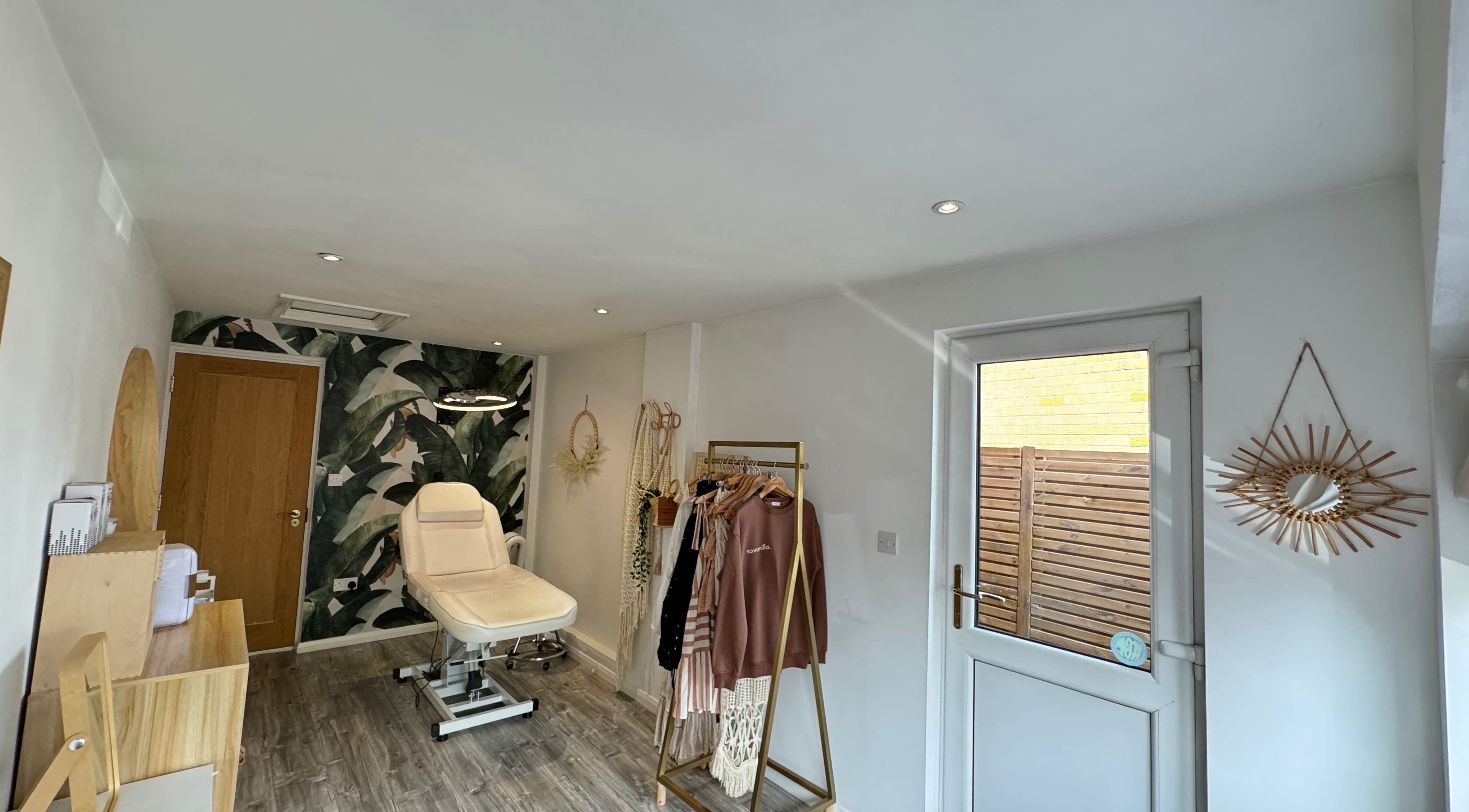 Stylish interior of SoVanilla Styling at Old Farm Park, England, GB. Features modern decor and treatment chair.