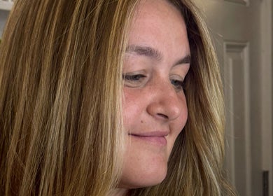 Client showcases freshly styled hair at Giulia Love Salon, New York, New York, US.