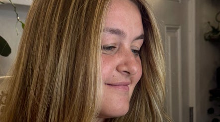 Client showcases freshly styled hair at Giulia Love Salon, New York, New York, US.