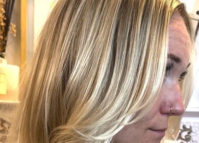 Elegant blonde hairstyle at Giulia Love Salon, New York, New York, US, showcasing professional hair color and style.