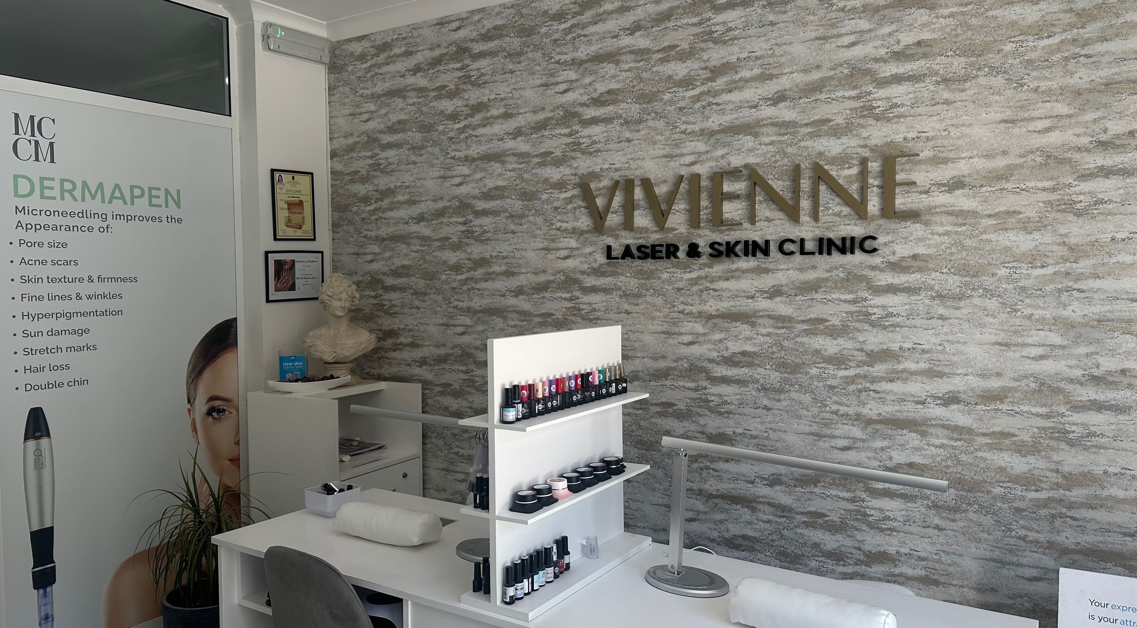 Vivienne Laser & Skin Clinic interior showcasing services at Wied Il-għajn, MT with skincare products displayed.