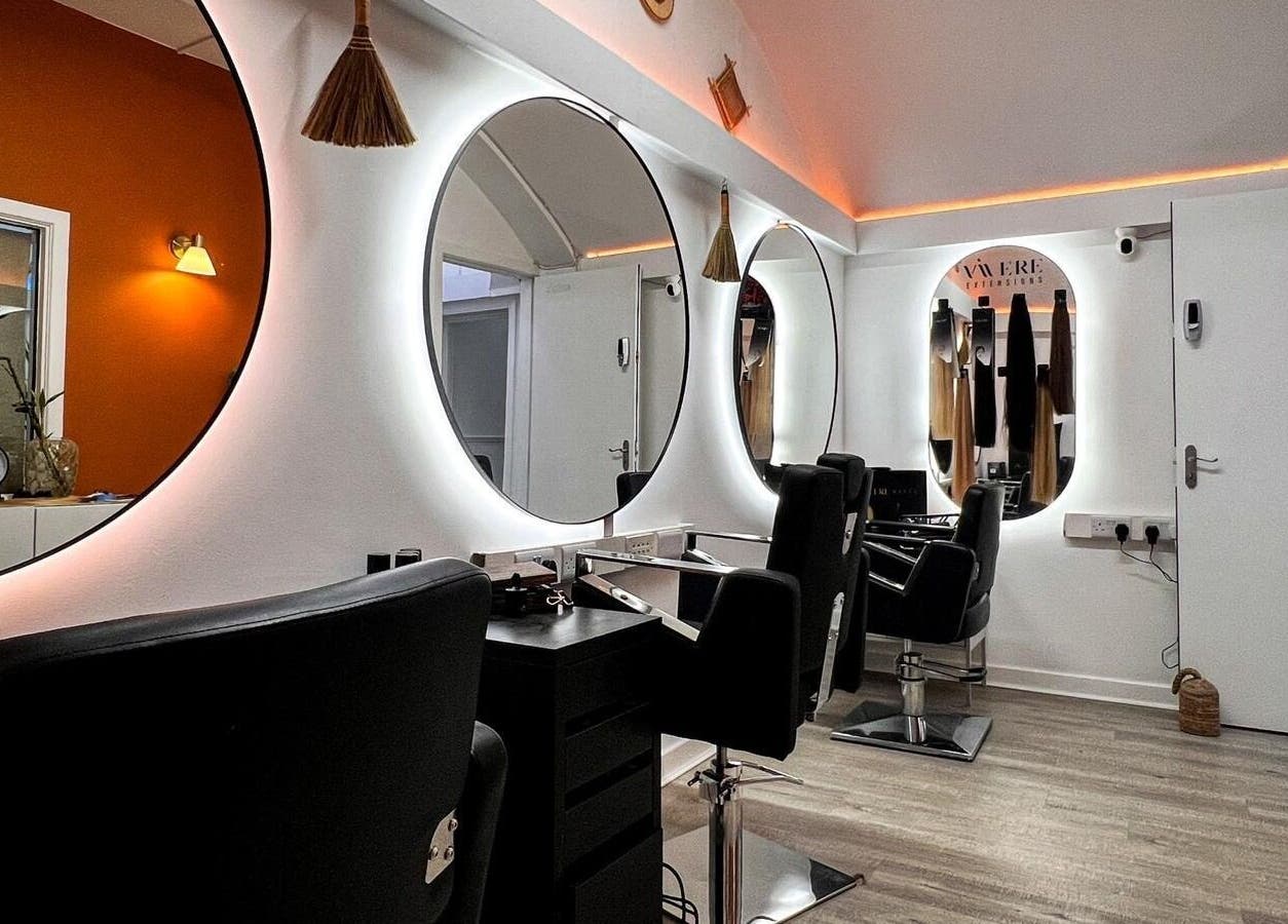 Modern salon interior at Vivere Concept, Dublin 2, County Dublin, IE, featuring stylish mirrors and chairs.