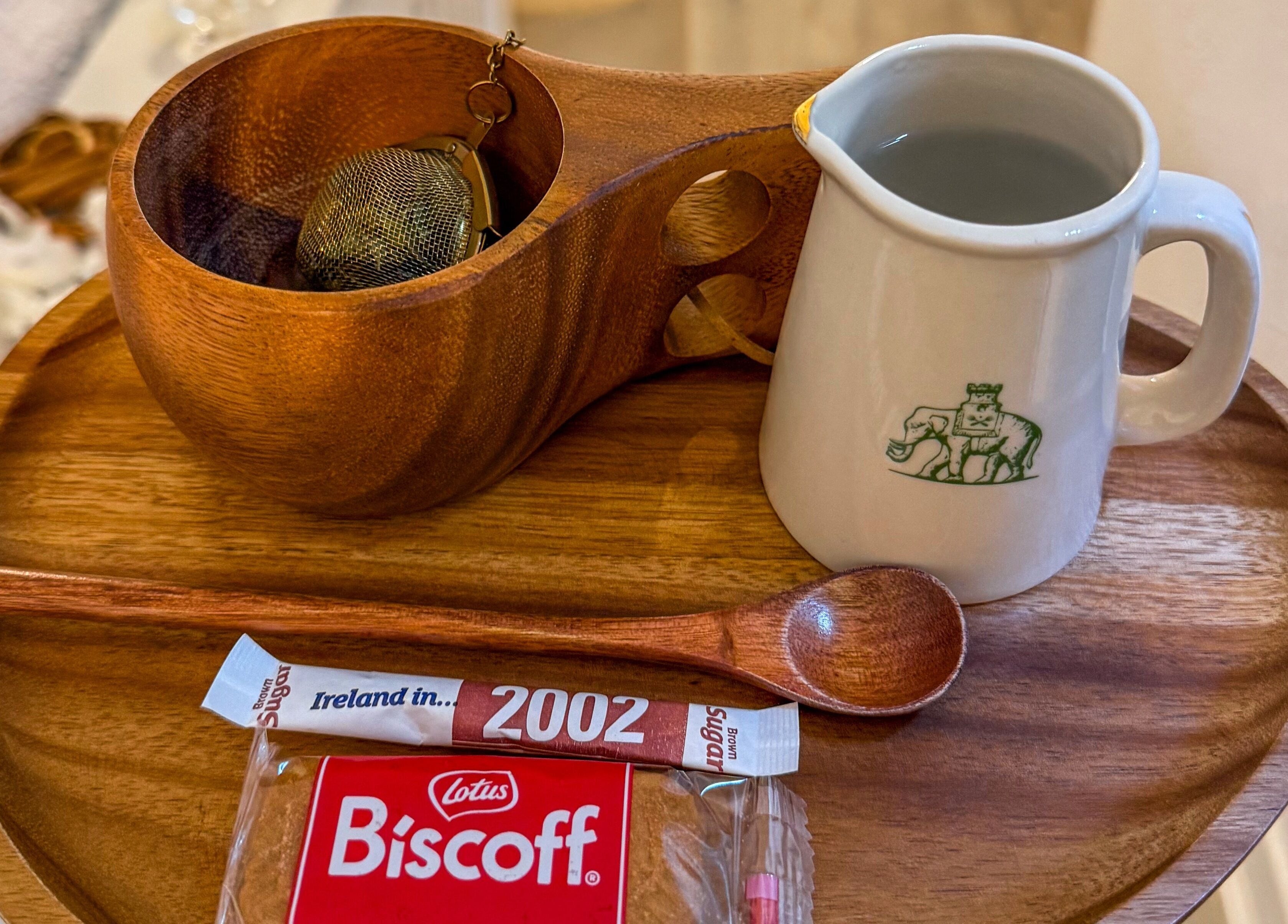Elegant wooden tray with tea cup and snack at Vivere Concept, Dublin 2, County Dublin, IE.