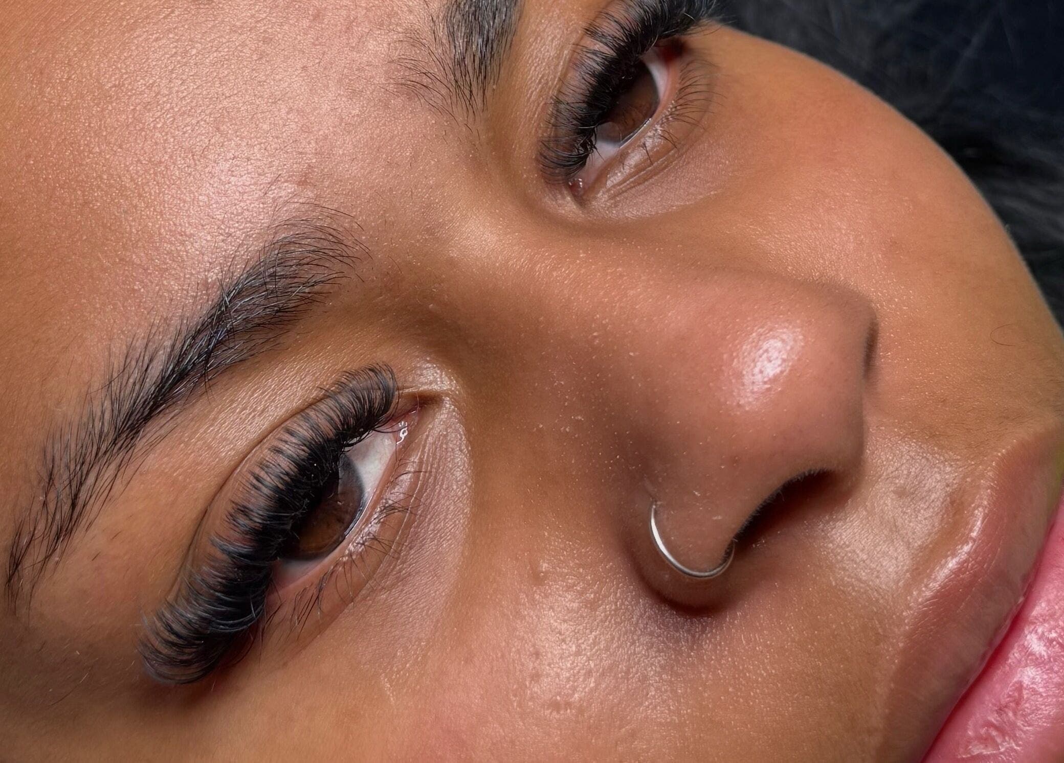 Close-up of exquisite eyelash extensions at EyeLuxeLounge, Tuffley, England, GB, highlighting detailed craftsmanship.