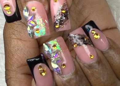 Intricate pink and black nail art with rhinestones at Nail House and Spa, Hollywood, Florida, US.