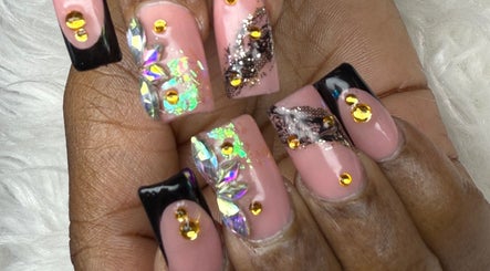 Intricate pink and black nail art with rhinestones at Nail House and Spa, Hollywood, Florida, US.
