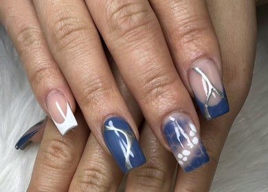 Stylish blue and white nail art at Nail House and Spa in Hollywood, Florida, US.