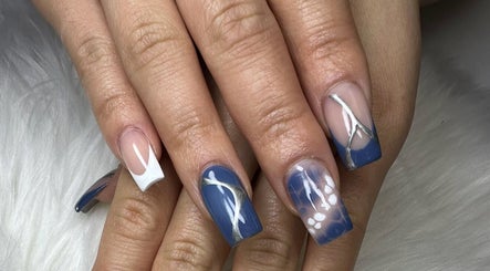 Stylish blue and white nail art at Nail House and Spa in Hollywood, Florida, US.
