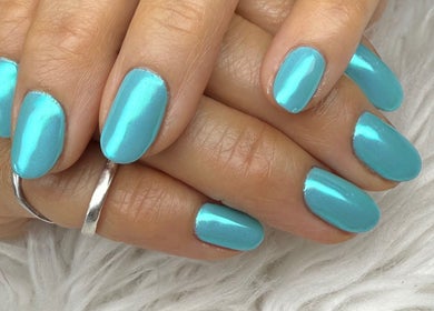 Stunning aqua manicure at Nail House and Spa, Hollywood, Florida, US, showcasing flawless nail art.
