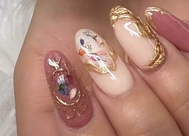 Elegant floral nail art with gold accents at Nail House and Spa, Hollywood, Florida, US.