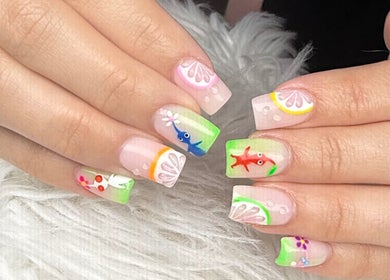 Colorful nail art with fruit and fish designs at Nail House and Spa, Hollywood, Florida, US.
