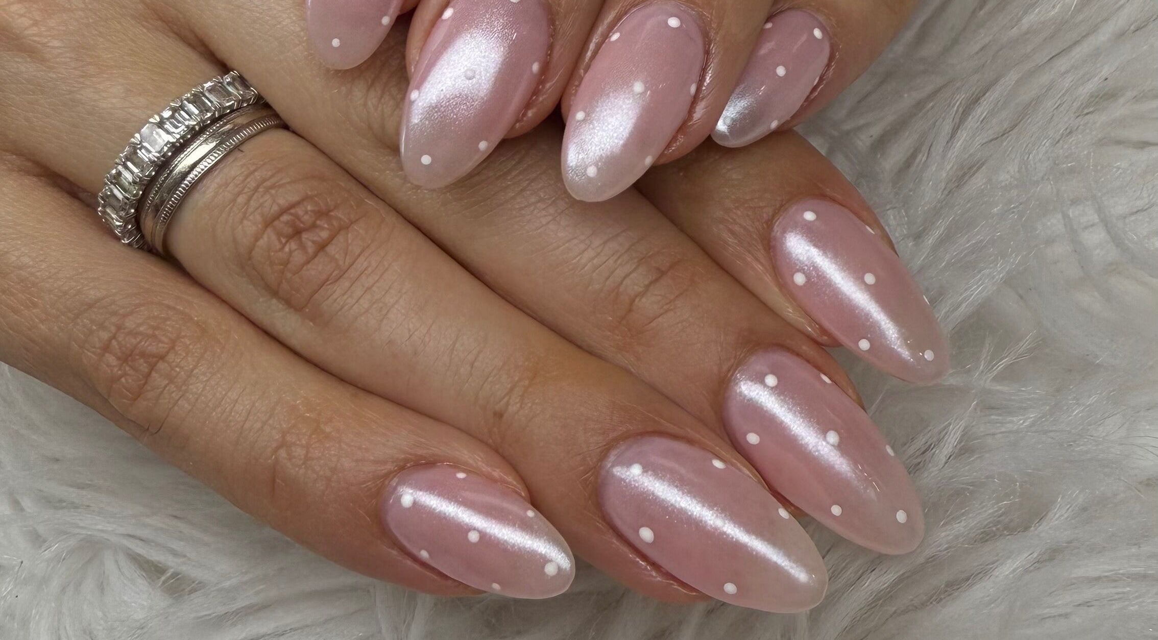 Chic dotted nails at Nail House and Spa, Hollywood, Florida, US, showcasing expert manicure art.