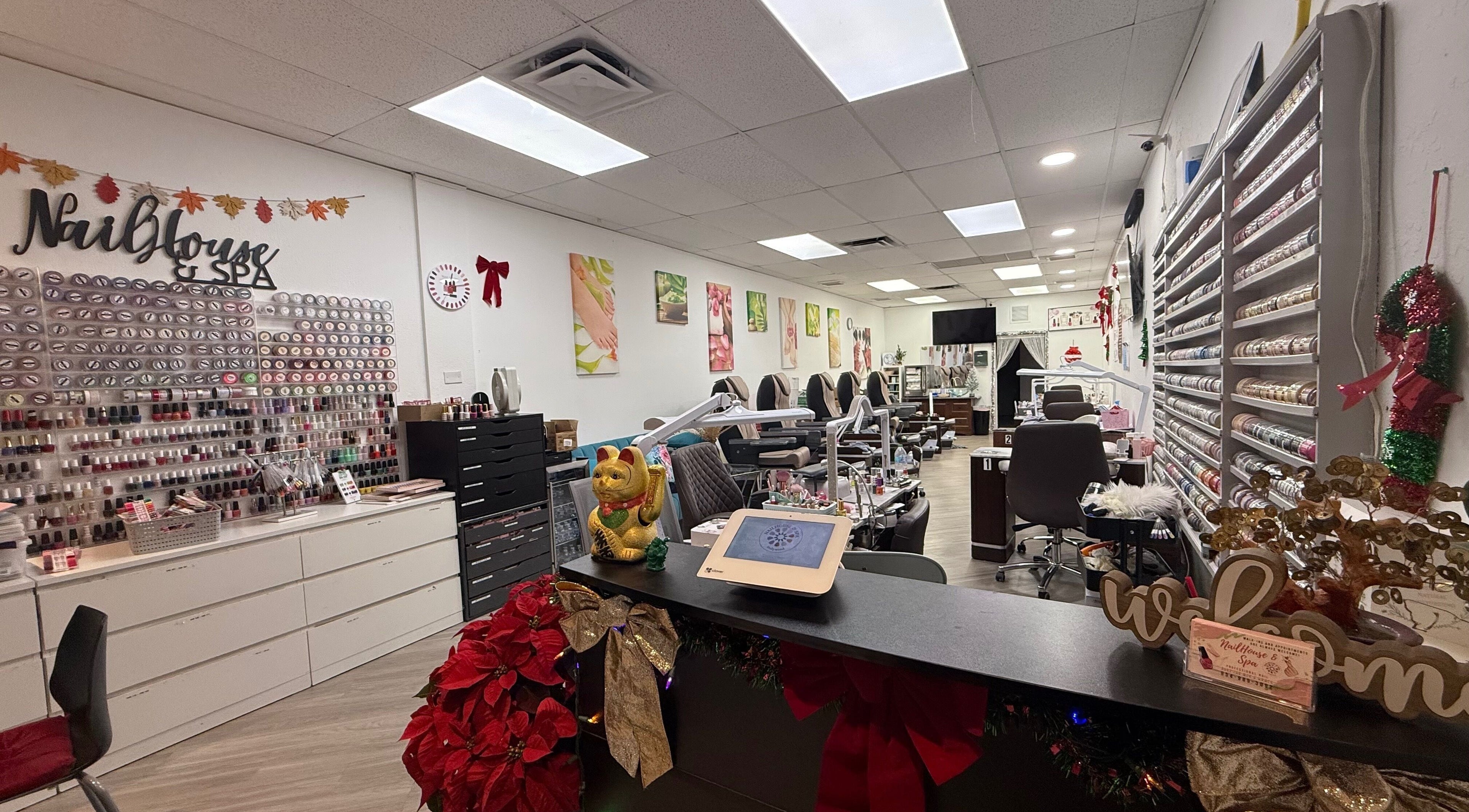 Interior of Nail House and Spa in Hollywood, Florida, US featuring rows of nail polish and pedicure chairs.