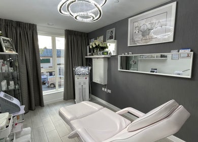 Chic treatment room at Roza Health & Beauty, London, England, GB featuring modern decor and equipment.