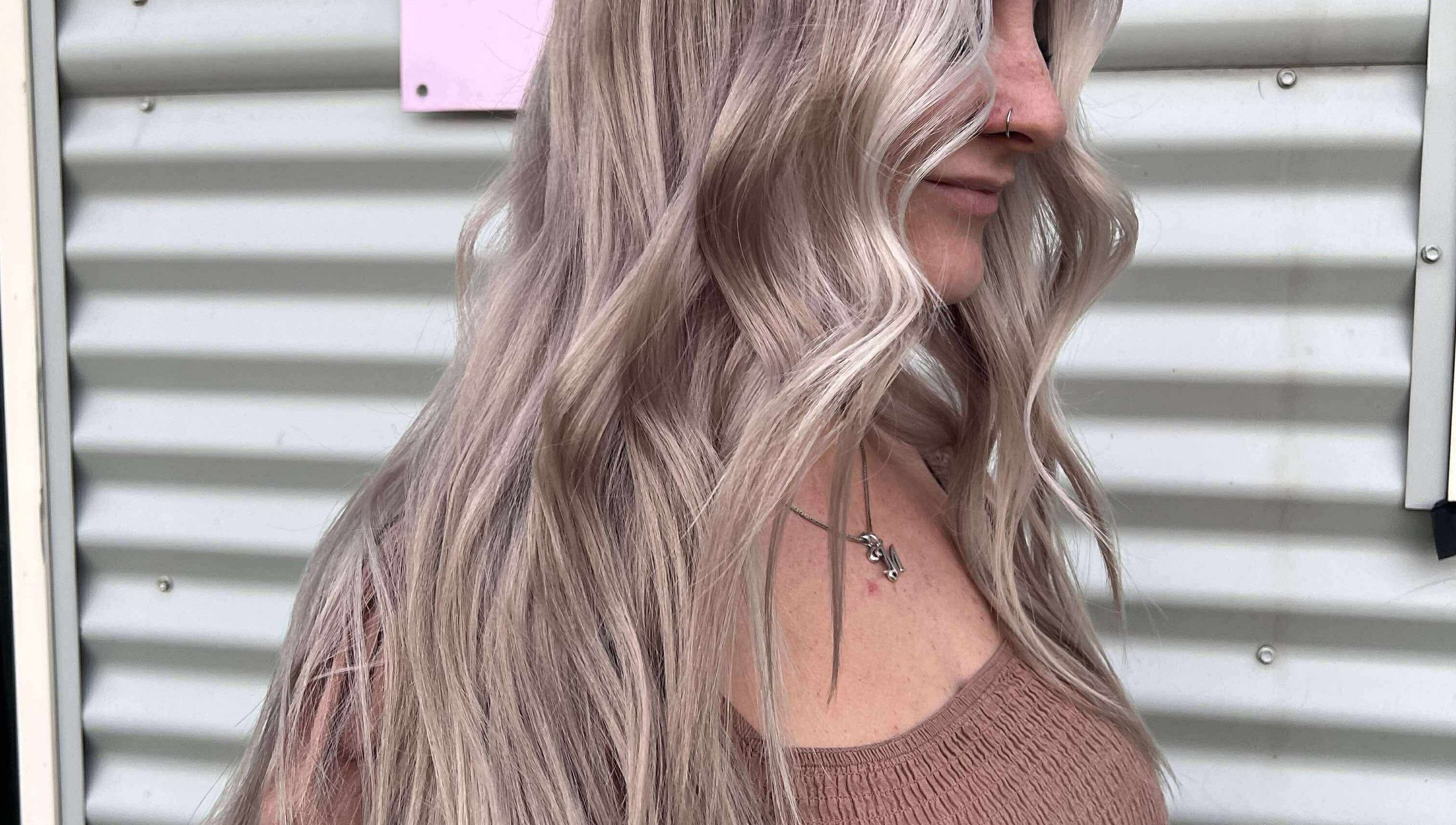 Woman with wavy blonde hair at CHEVEU, Jimboomba, Queensland, AU.