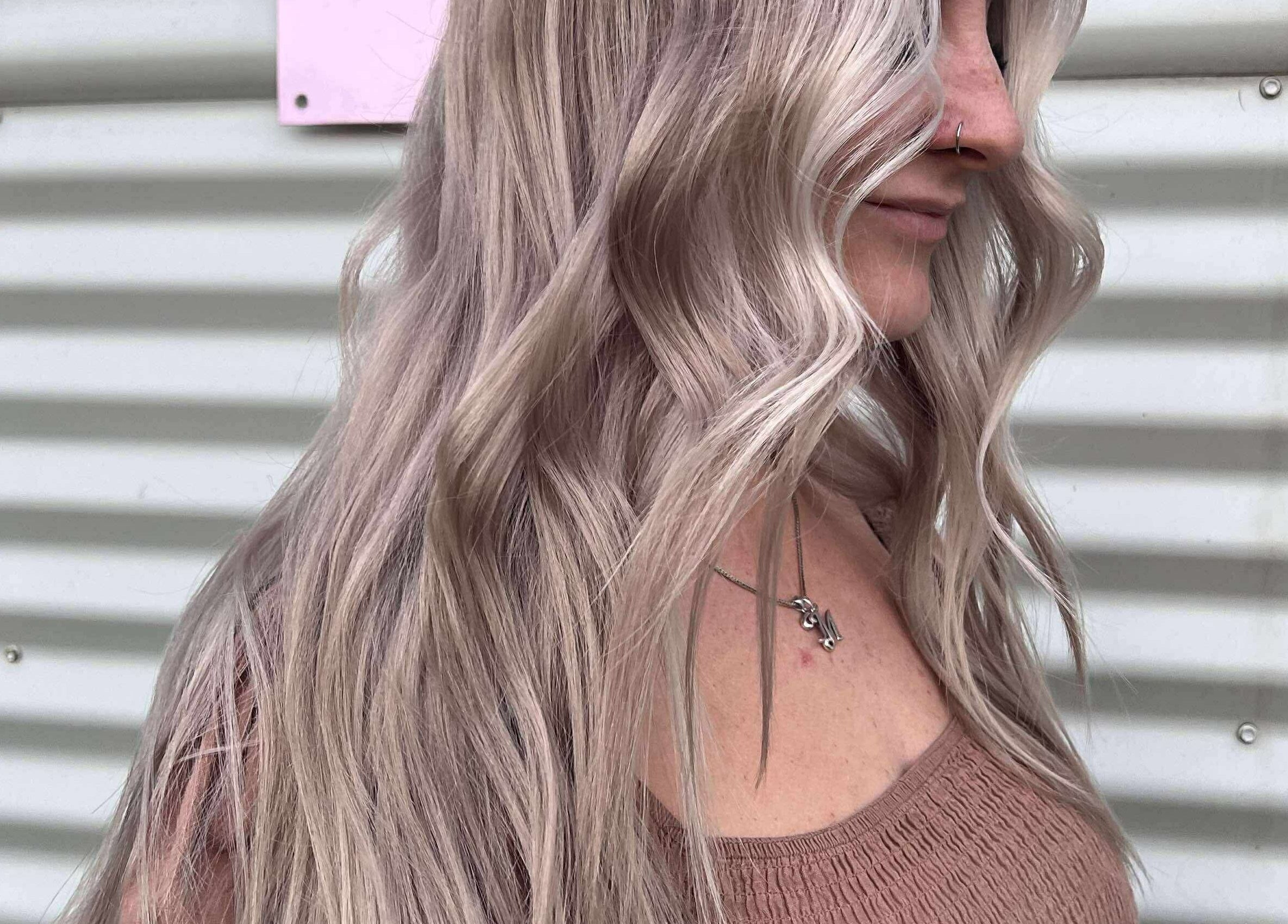 Woman with wavy blonde hair at CHEVEU, Jimboomba, Queensland, AU.