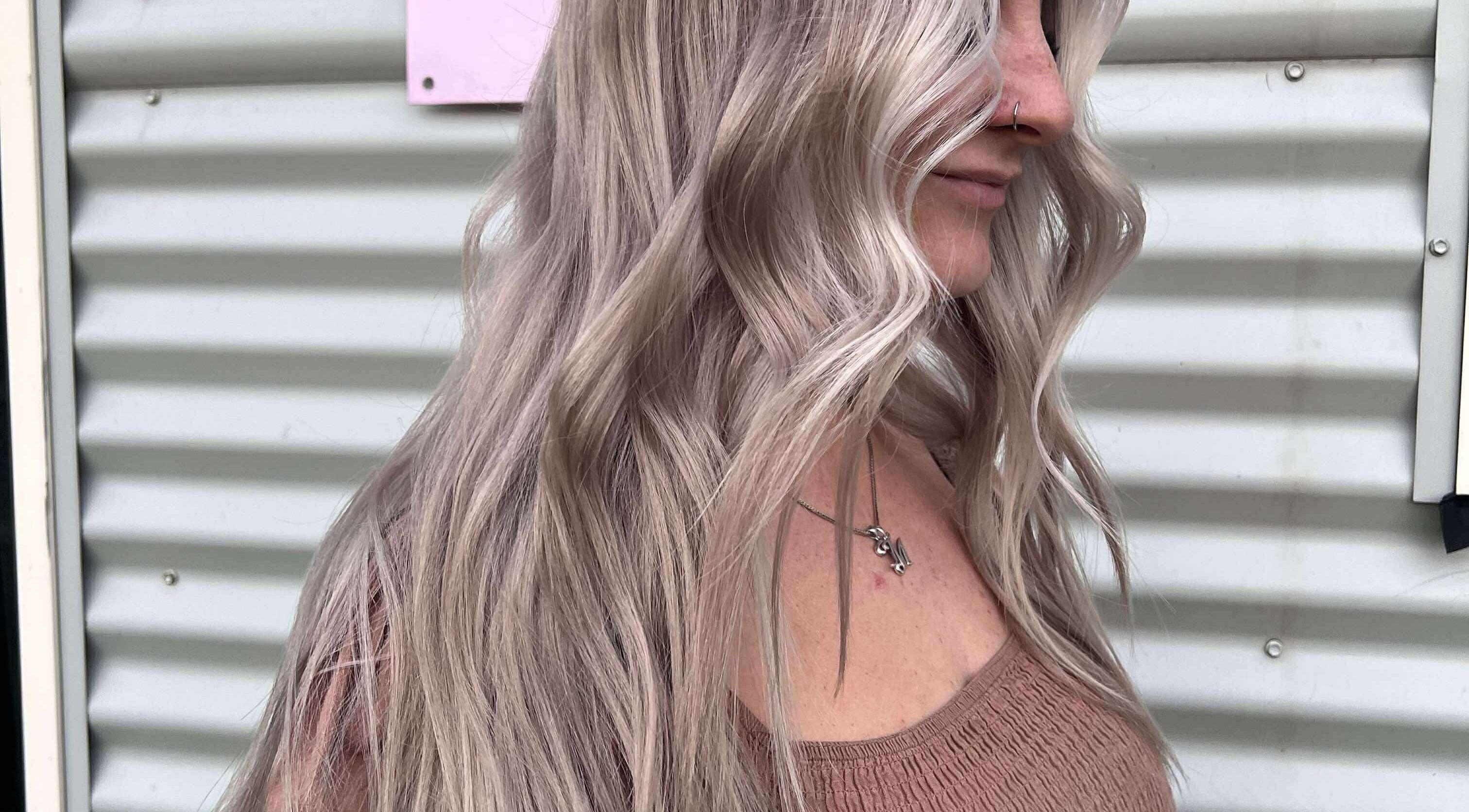 Woman with wavy blonde hair at CHEVEU, Jimboomba, Queensland, AU.