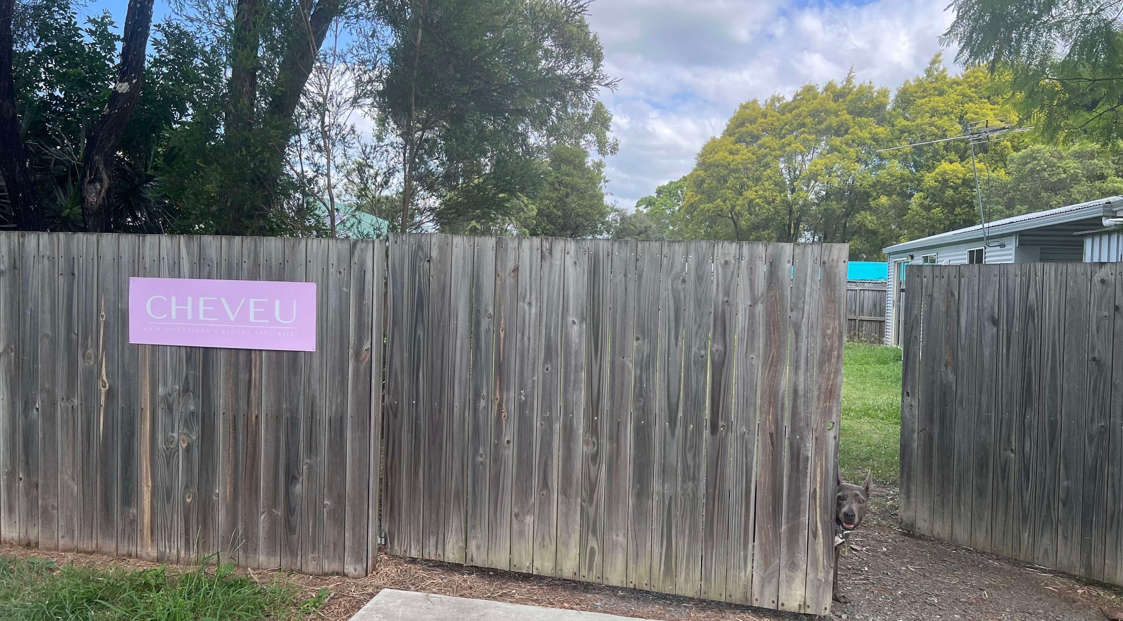 Entrance gate of CHEVEU in Jimboomba, Queensland, AU with a welcoming sign and greenery.