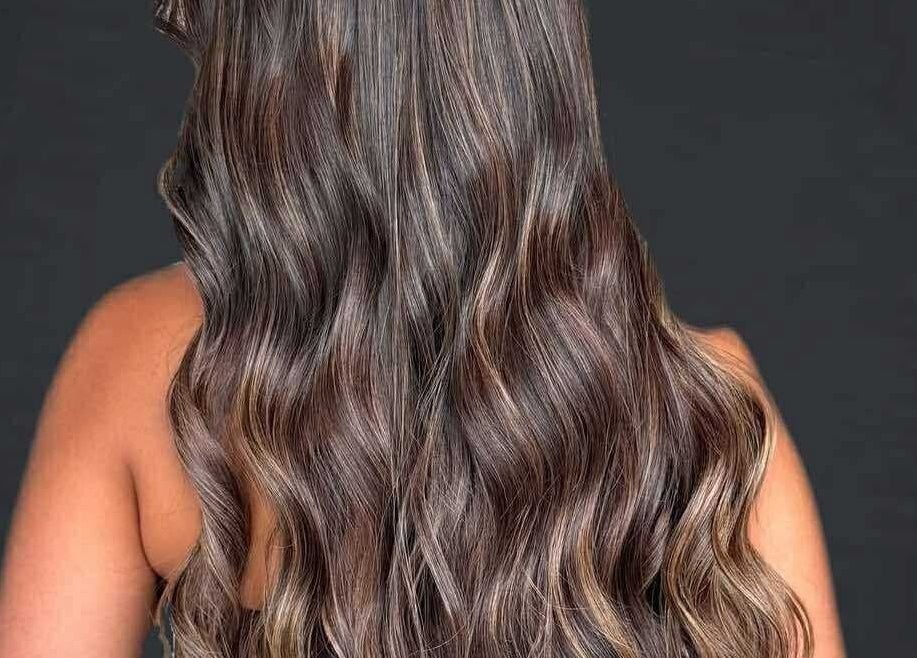 Elegant wavy hairstyle at CHEVEU in Jimboomba, Queensland, AU, showcasing rich brunette tones.