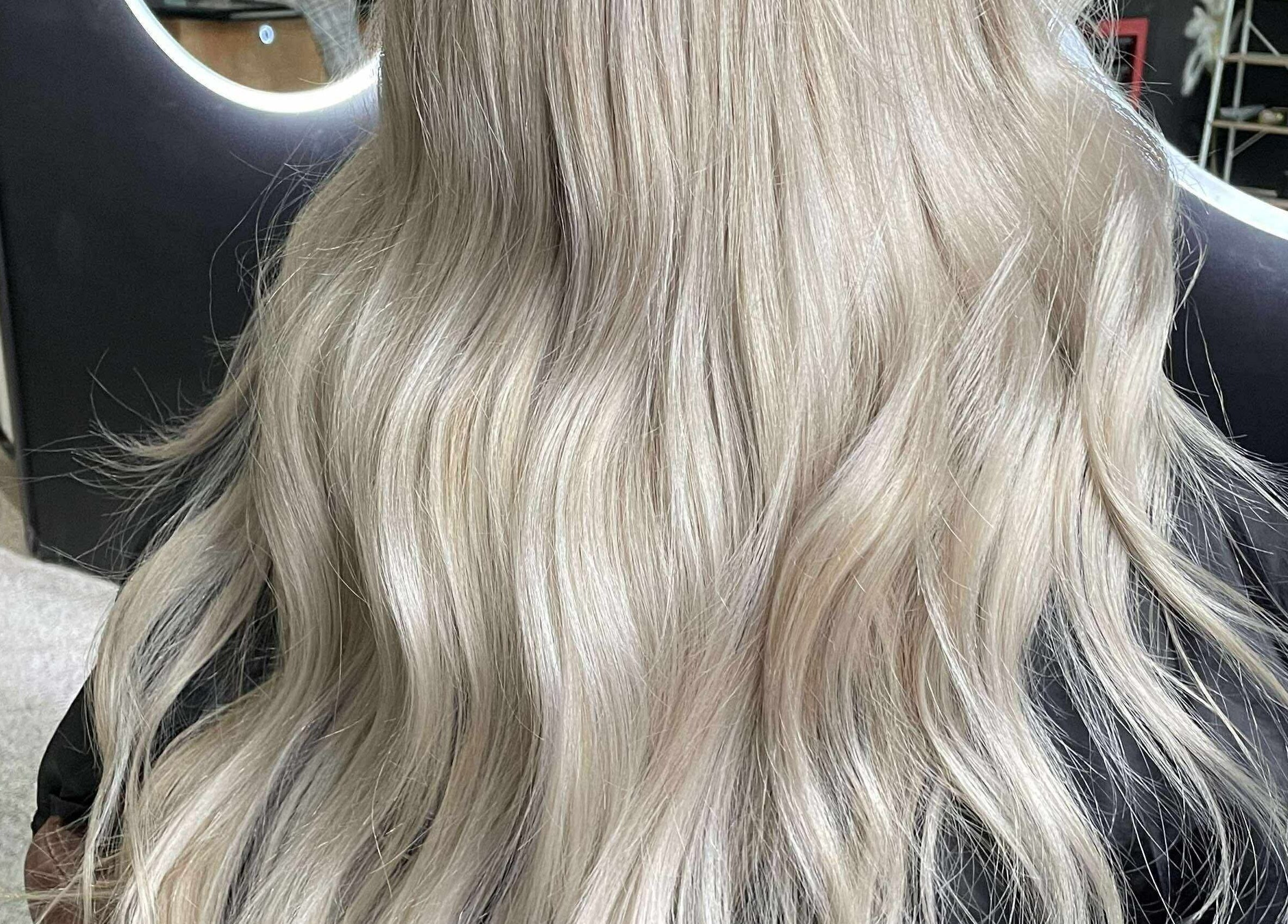 Elegant blonde waves styled at CHEVEU in Jimboomba, Queensland, AU reflecting modern hair trends.