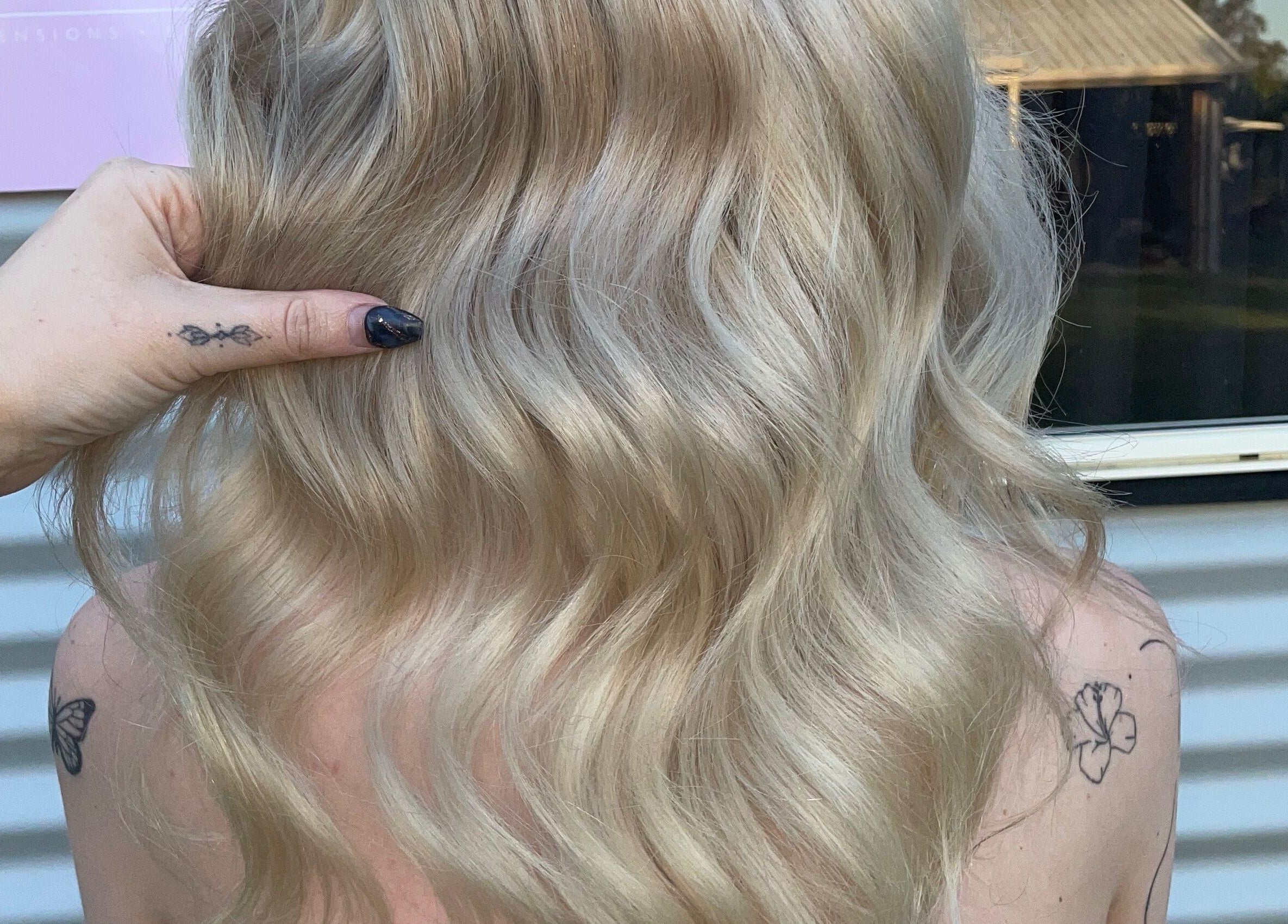 Blonde wavy hair styled at CHEVEU salon, Jimboomba, Queensland, AU, showcasing professional hair artistry.