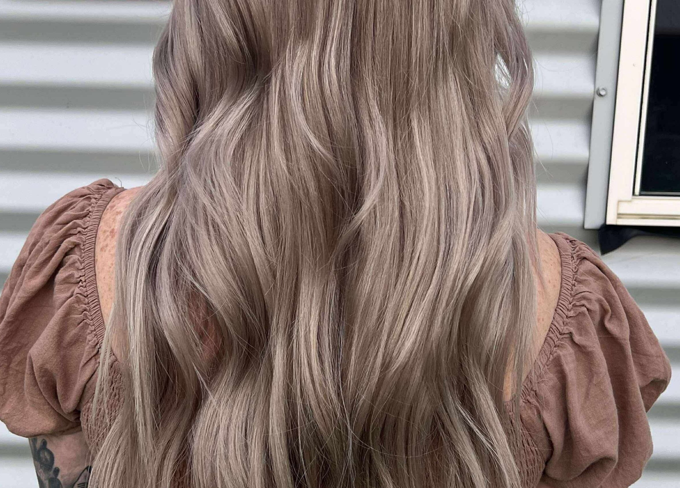 Elegant wavy hairstyle at CHEVEU, Jimboomba, Queensland, AU. Perfect for a stylish, refined look.