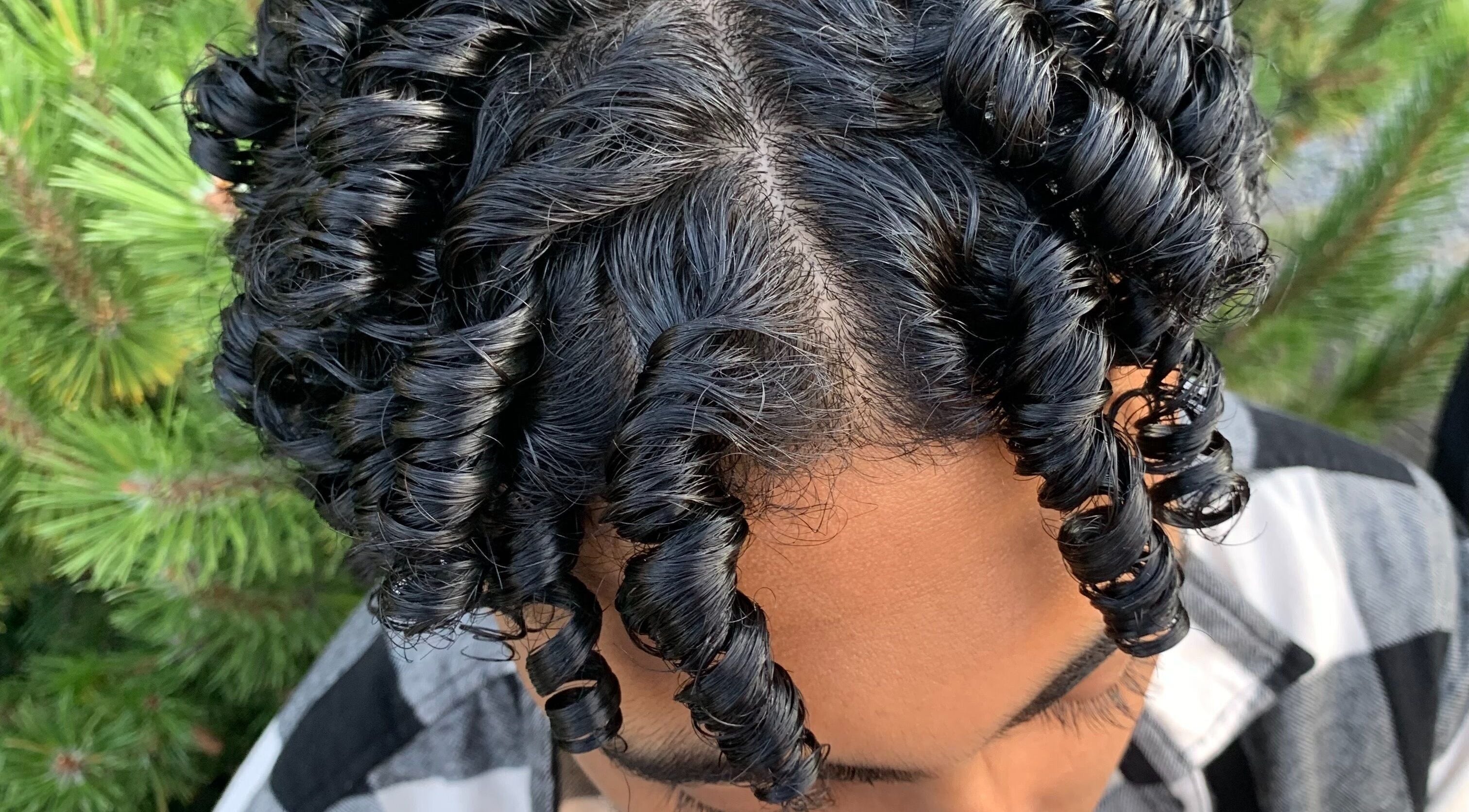 Elegant curls styled at Zayythebarber in Surrey, British Columbia, CA, showcasing expert haircare.