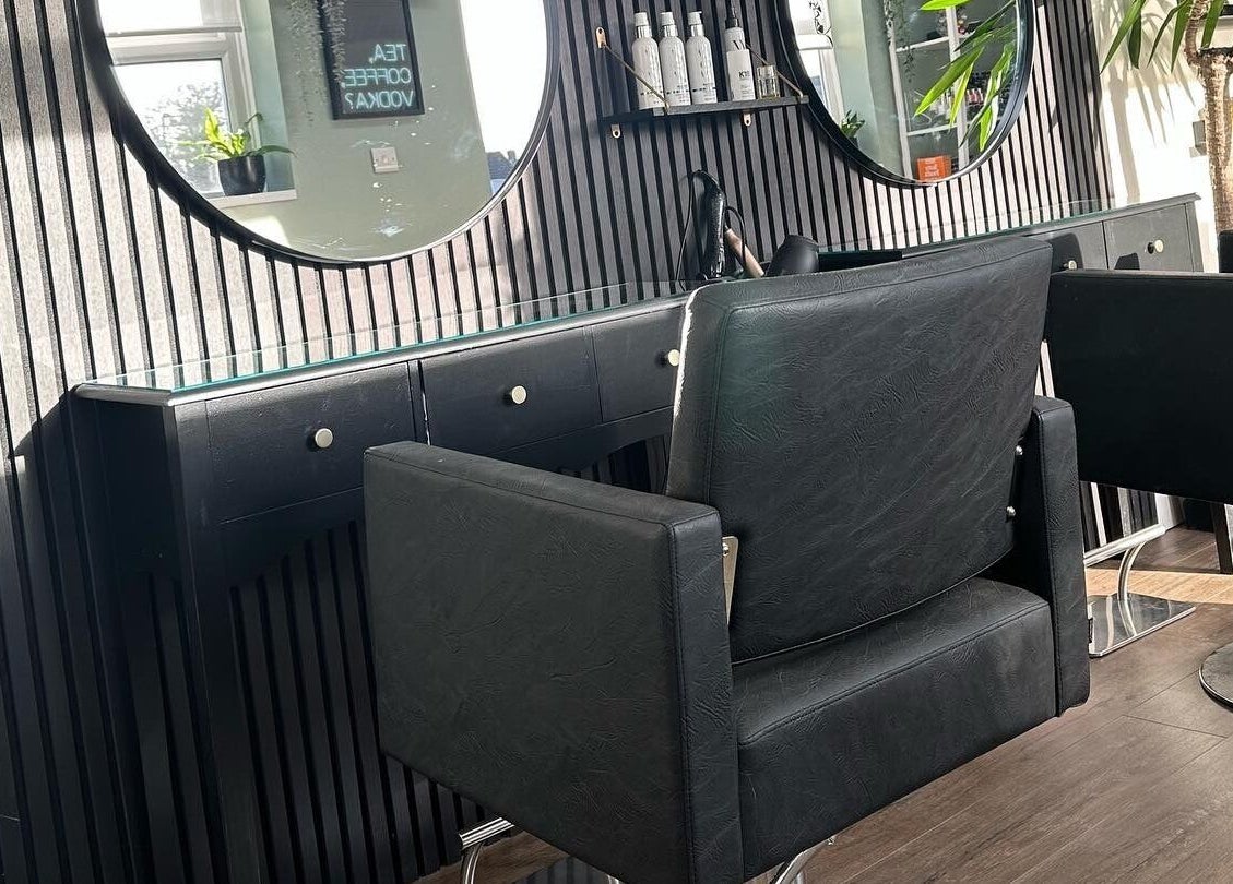 Modern salon chairs at Envious Salon in Crawley, England, GB offer a stylish and comfortable experience.