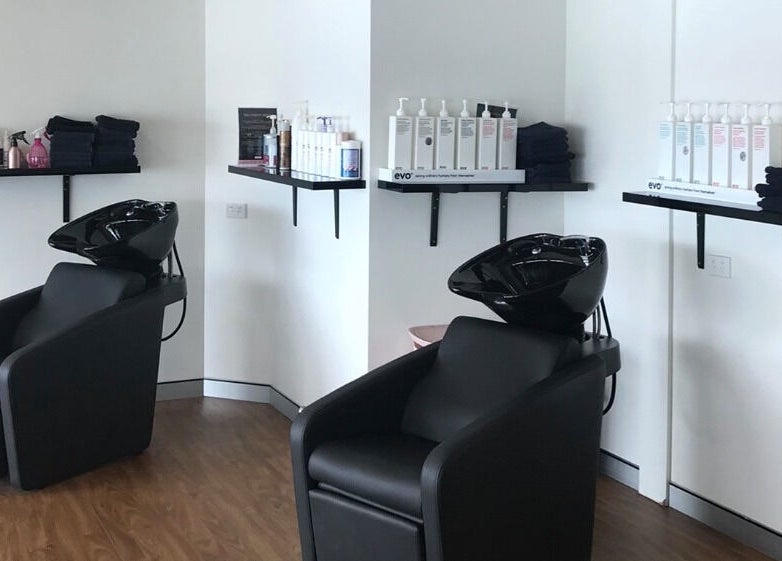 Chic hair wash stations at Studio Vogue Salon in Baringa, Queensland, AU, offering top-notch hair treatments.