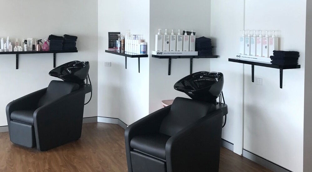 Chic hair wash stations at Studio Vogue Salon in Baringa, Queensland, AU, offering top-notch hair treatments.
